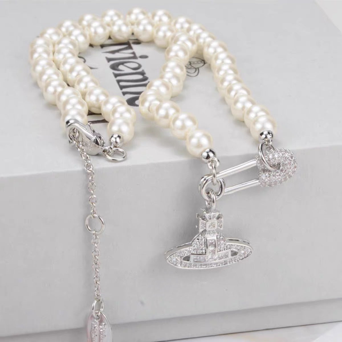 Buy replica Vivienne Westwood Paperclip Saturn Pearl Necklace and replica jewelry from PICKS Jewelry