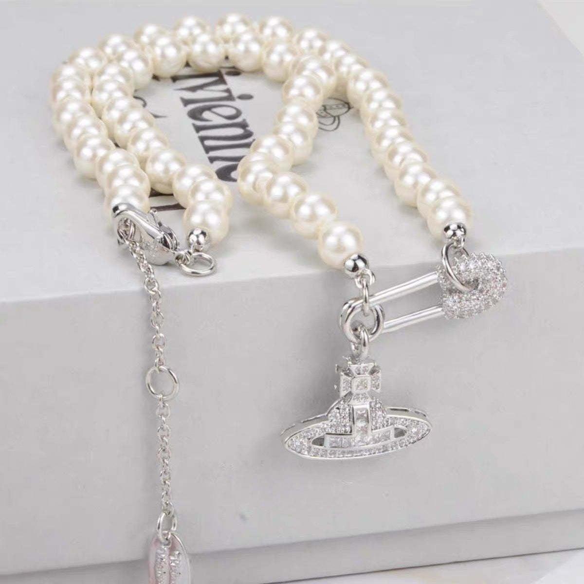 Buy replica Vivienne Westwood Paperclip Saturn Pearl Necklace and replica jewelry from PICKS Jewelry