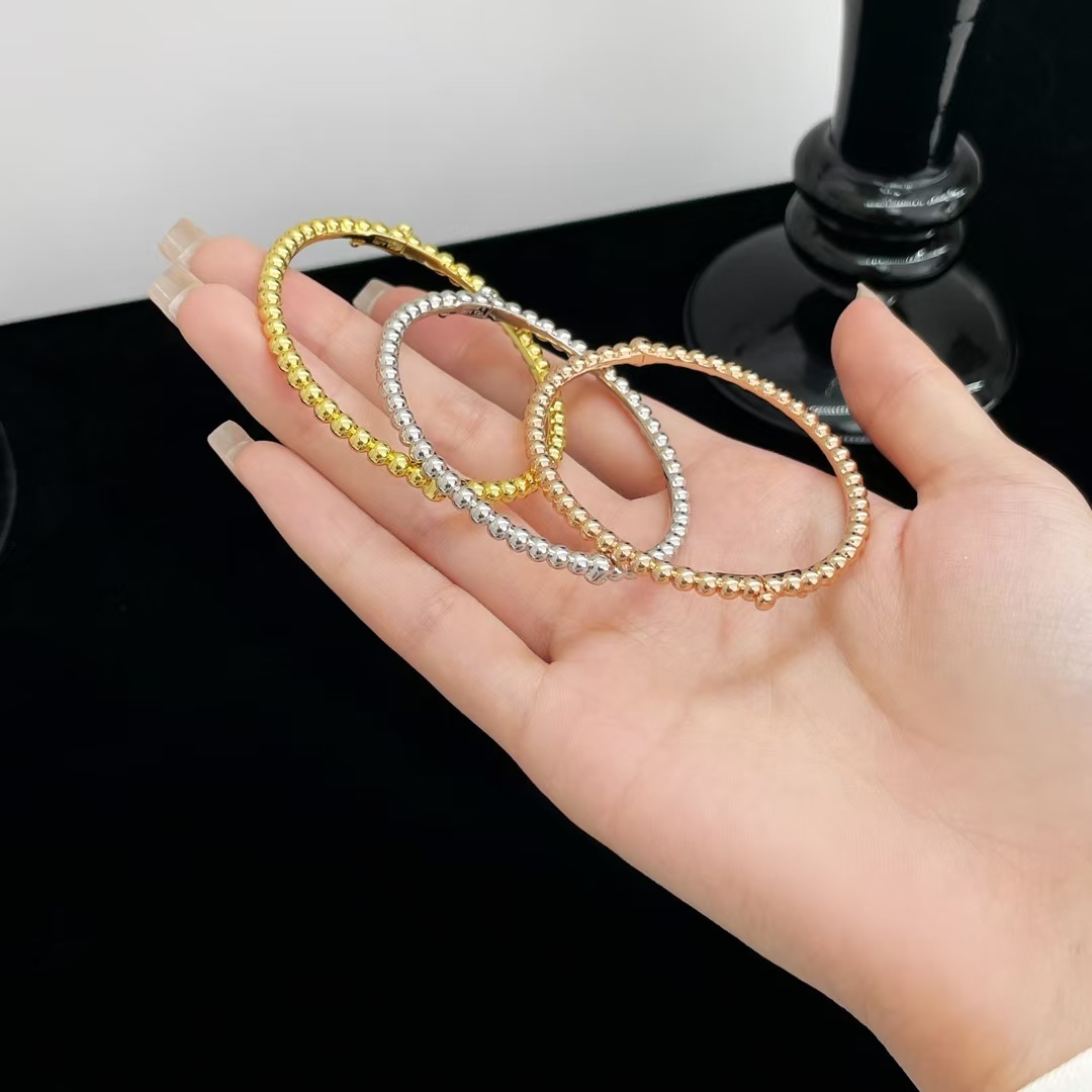 Buy replica Van Cleef & Arpels Perlée Pearls of Gold Bracelet - Medium Bangle and replica jewelry from PICKS Jewelry