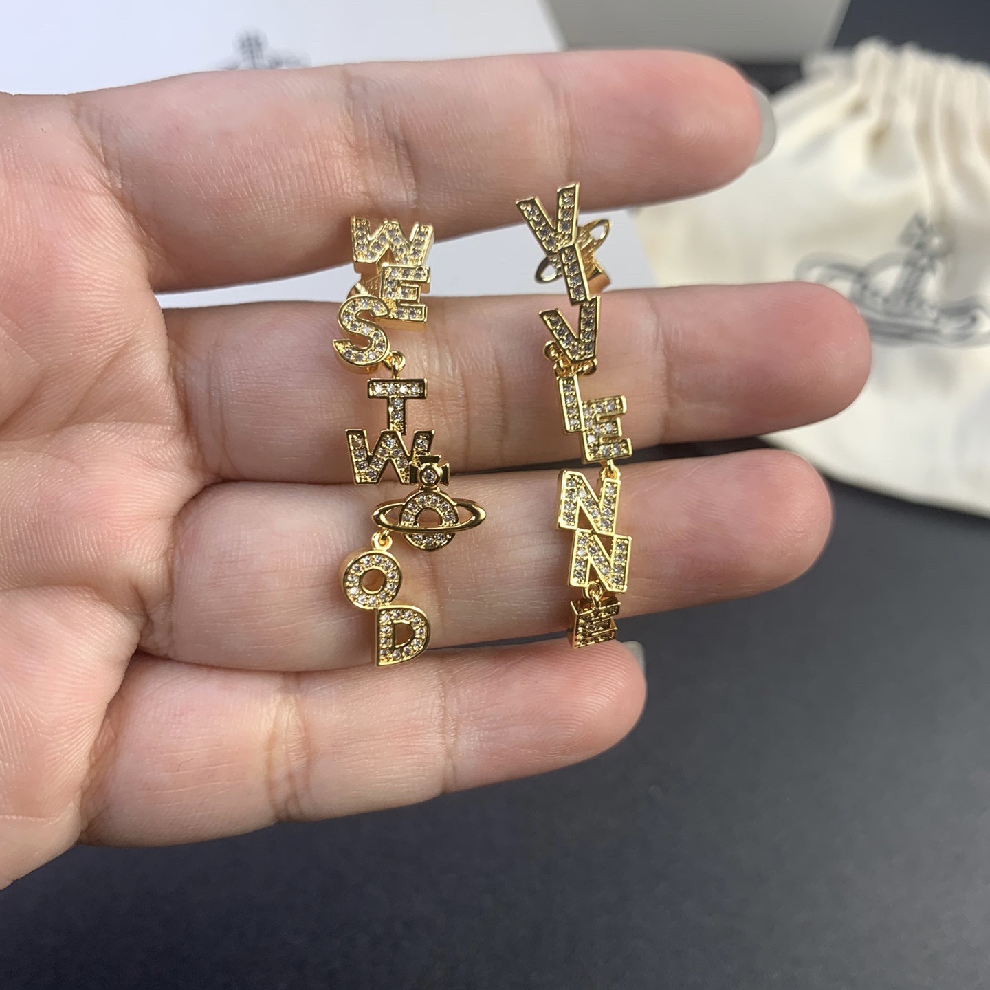 Buy replica Vivienne Westwood Letters Asymmetric Earrings and replica jewelry from PICKS Jewelry
