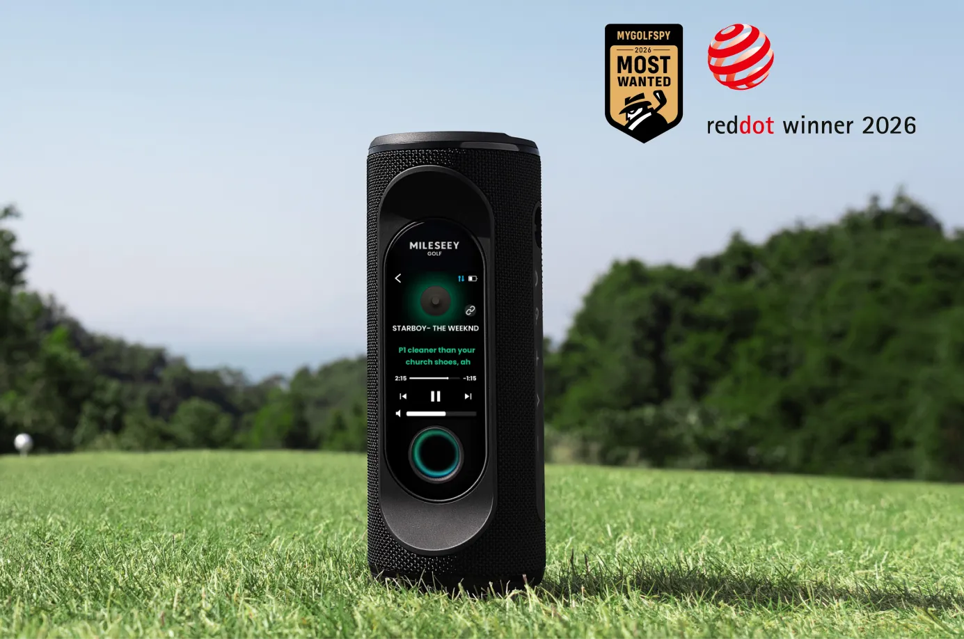 GeneSonic Pro speaker standing on the grass playing music, with the MyGolfSpy Most Wanted badge and Red Dot Winner 2026 logo above