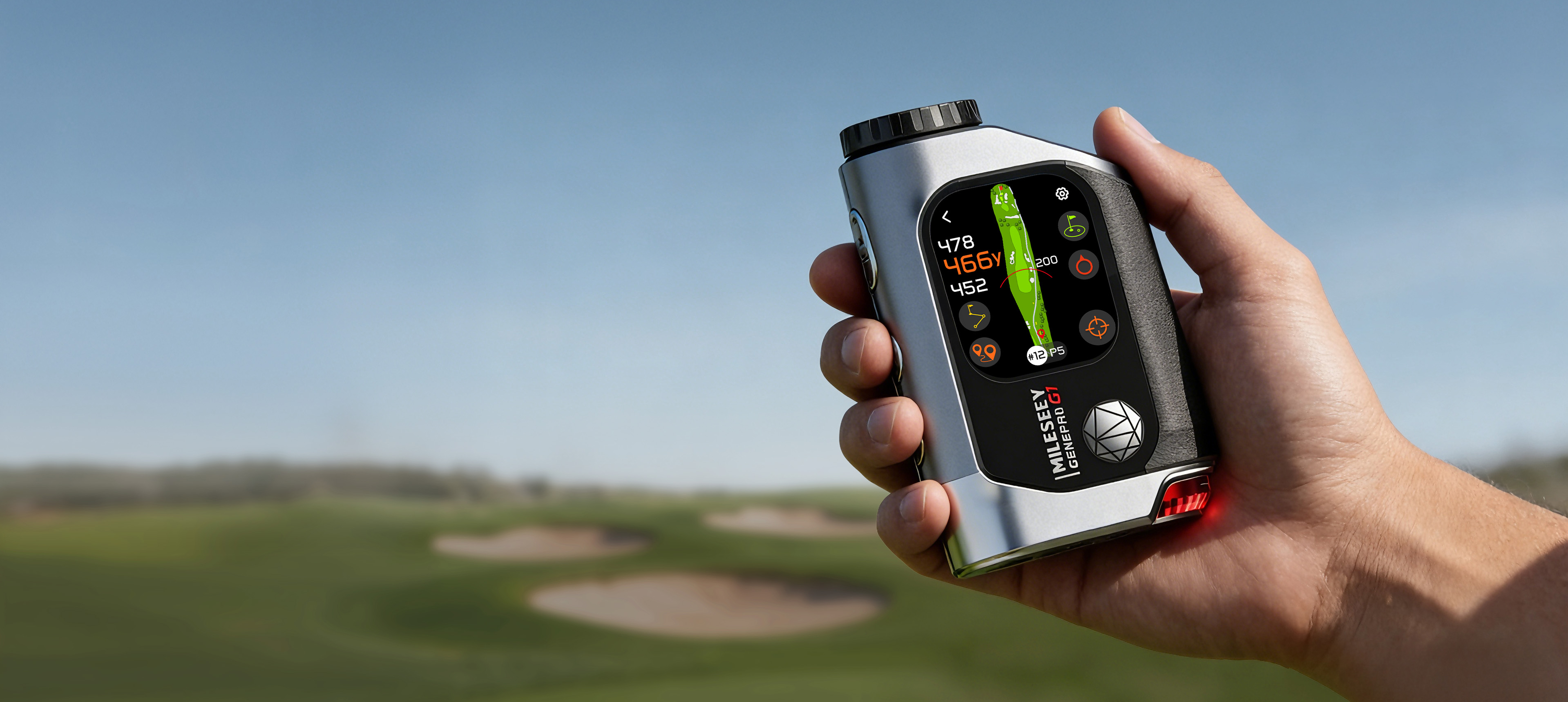 Hand holding the Mileseey GenePro G1 on a green with bunkers