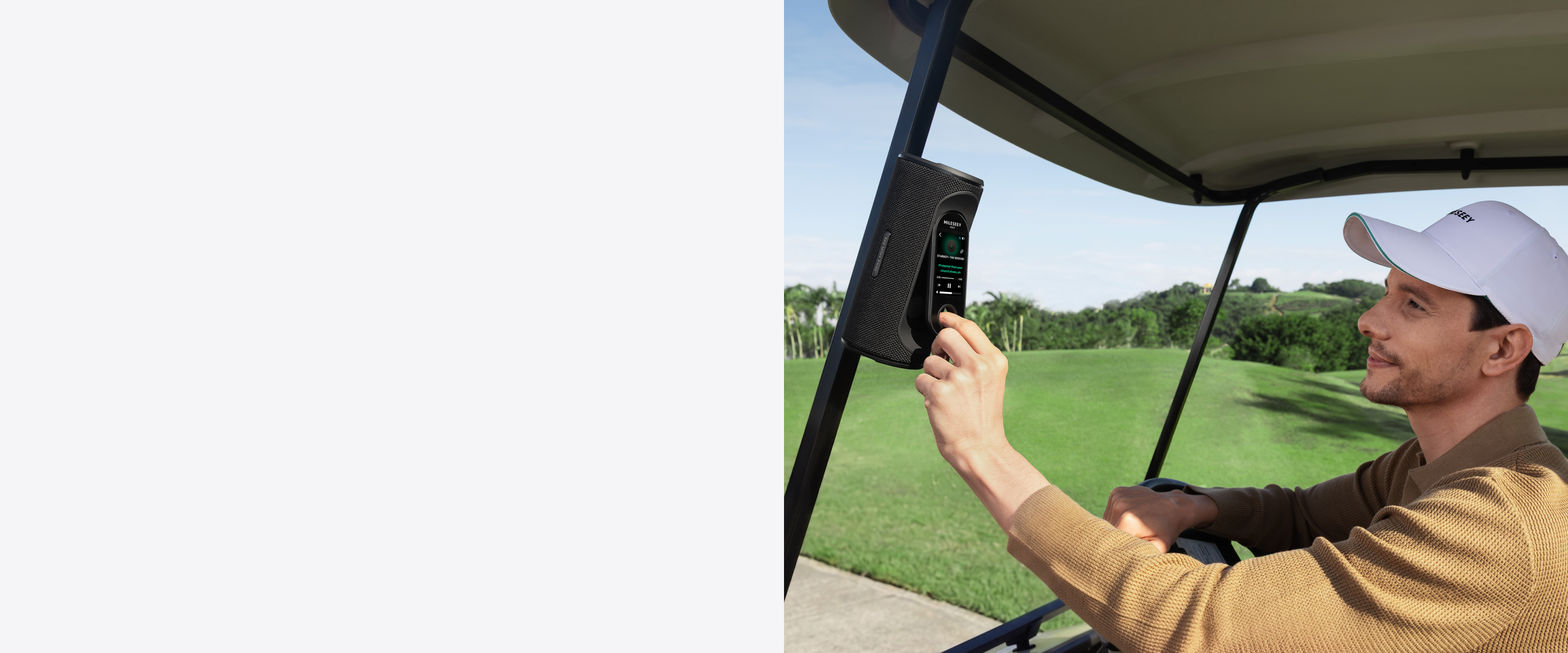 A golfer touches the MILESEEY GeneSonic Pro GPS golf speaker mounted on a golf cart.