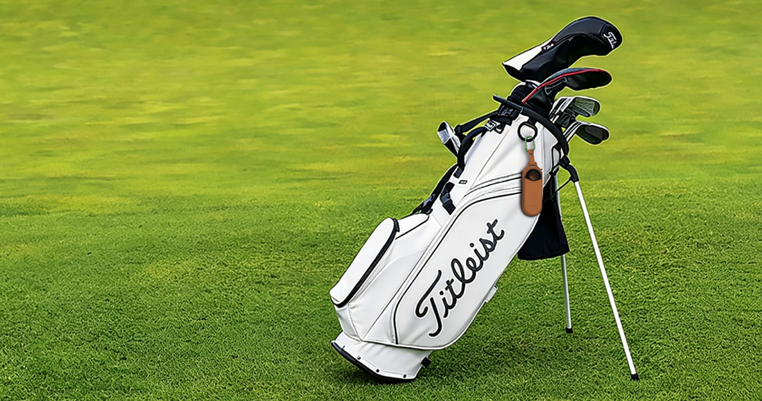 MILESEEY GeneSonic Go Golf GPS Handheld in a leather case attached to a Titleist golf bag on the course