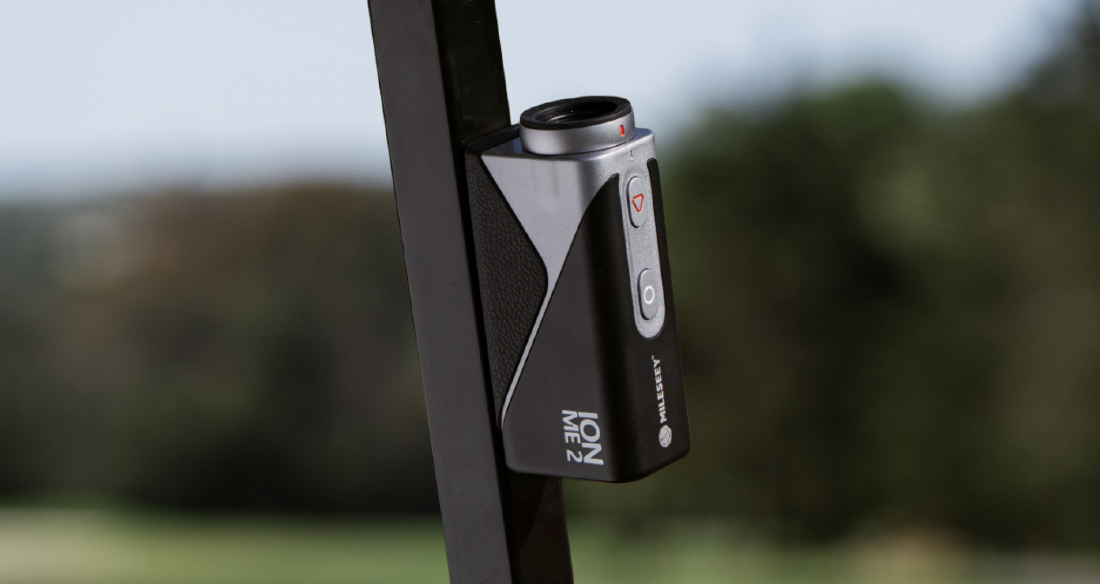 Mileseey IONME2 rangefinder magnetically attached to a golf club shaft