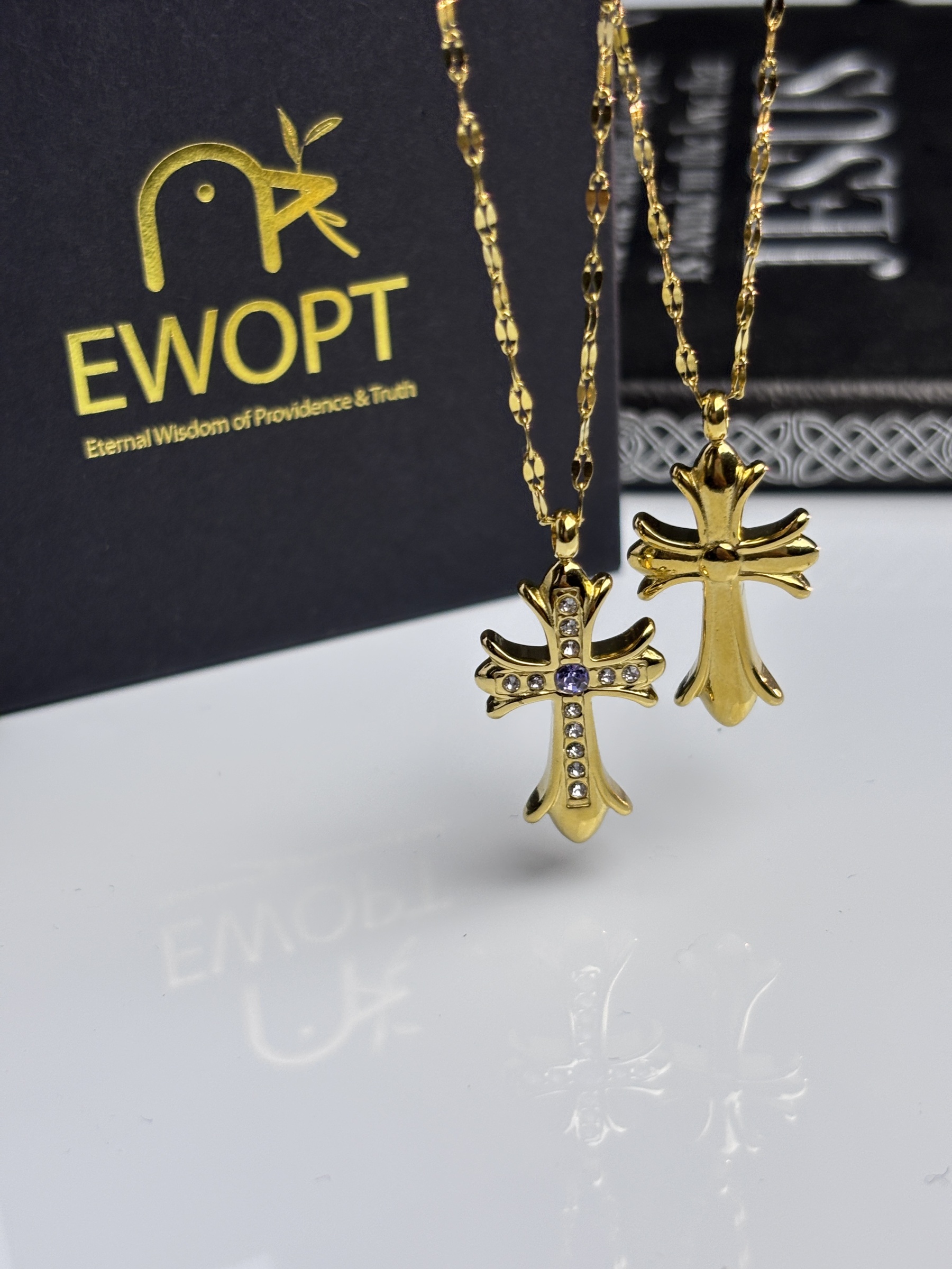 Elegant cross necklace in gold with jewel details, comes with a unique NFC keychain to unlock daily blessings from the Bible.