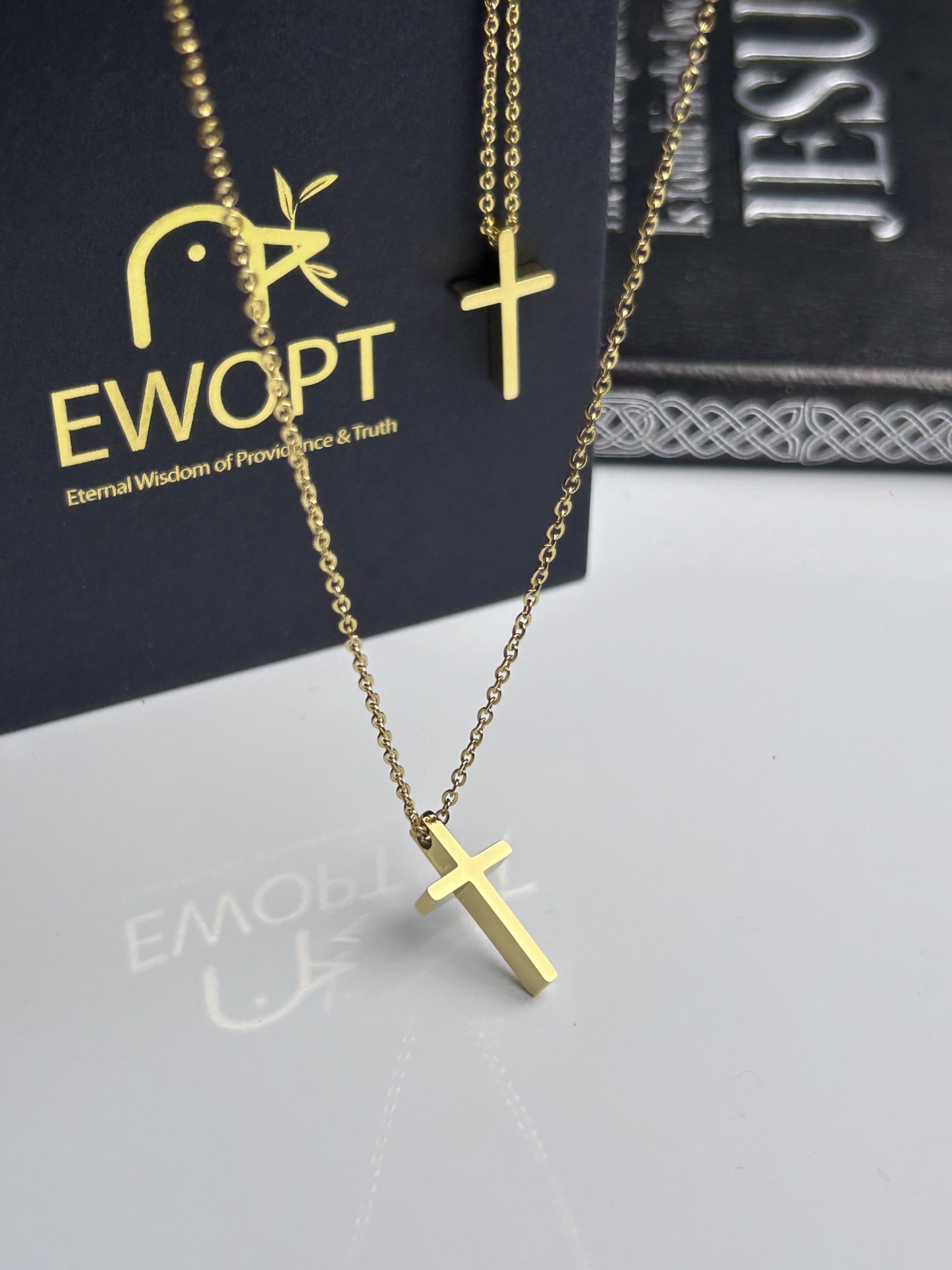Gold-tone cross necklace paired with a revolutionary NFC keychain that provides instant access to daily Bible verses, designed for devout Christians seeking a modern approach to faith.