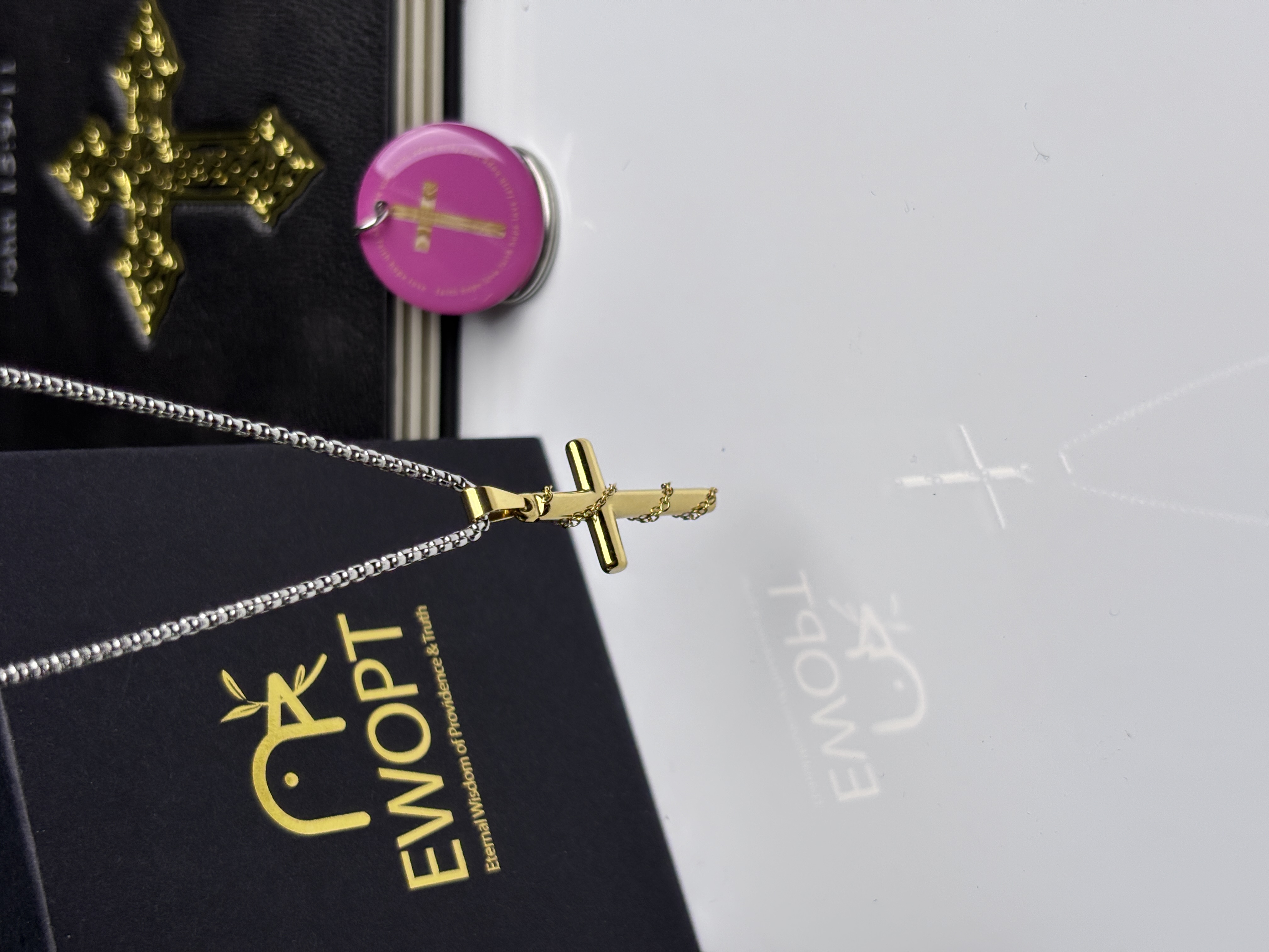 Gold-plated cross necklace adorned with a scripture-revealing NFC keychain, merging timeless elegance with modern technology to keep the word of God close.