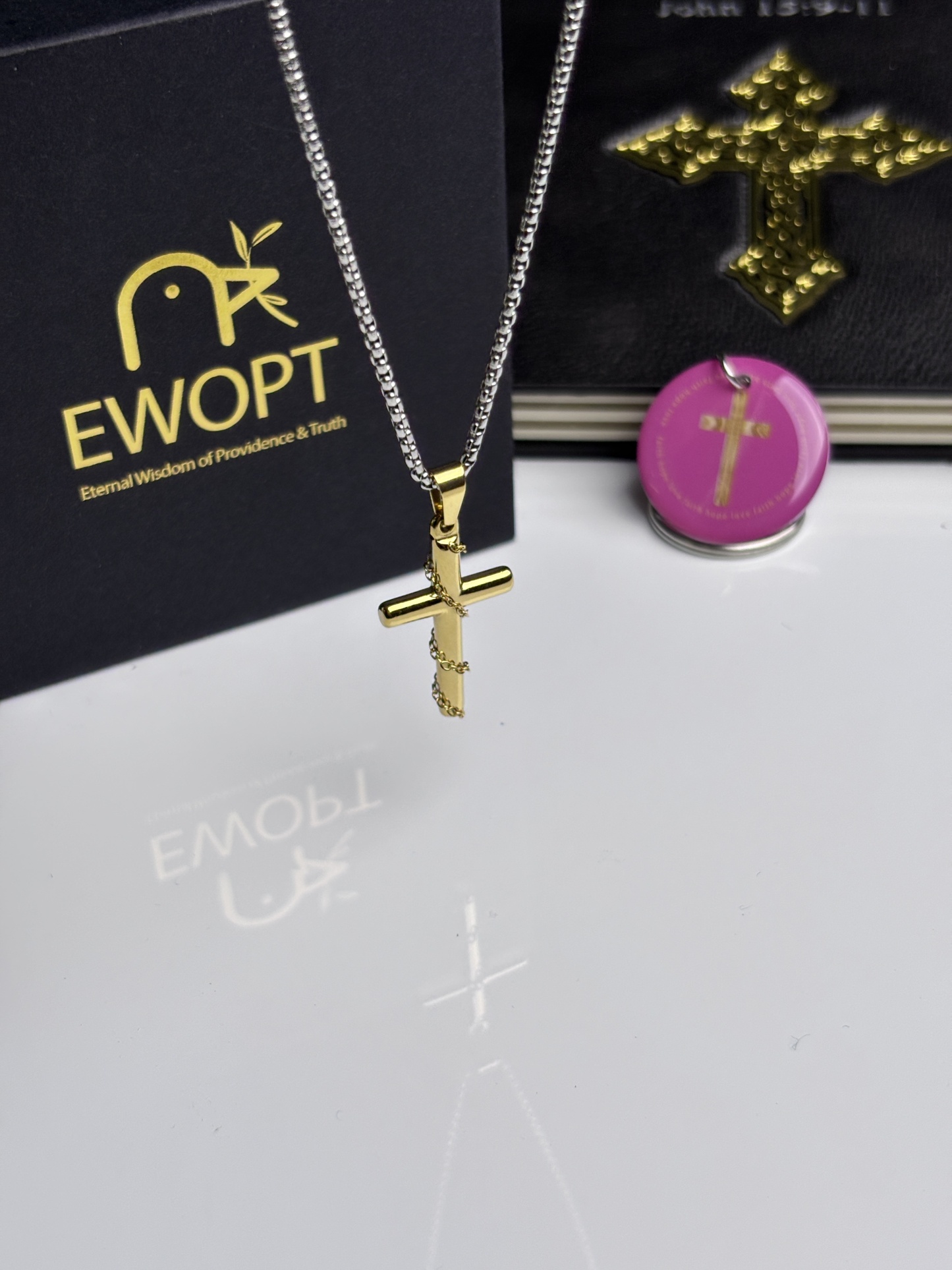 Gold-plated cross necklace adorned with a scripture-revealing NFC keychain, merging timeless elegance with modern technology to keep the word of God close.