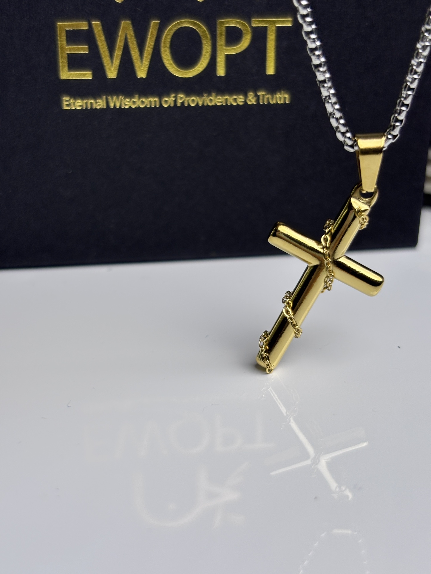 Stylish gold cross necklace with a sleek design, featuring an NFC keychain that offers quick access to daily Bible scriptures, combining fashion with faith.