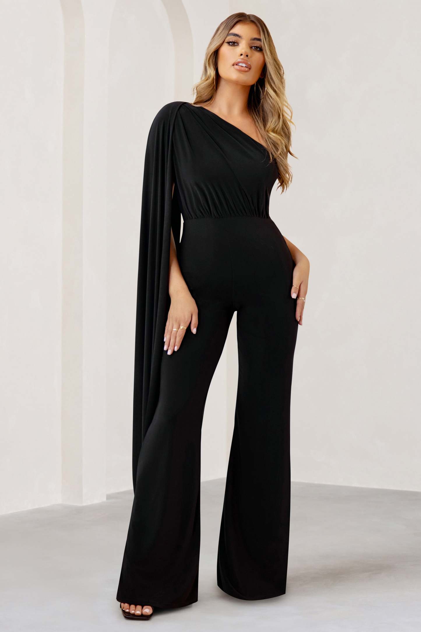 Aurora Black One Shoulder Cape Sleeve Jumpsuit-Fashionmomo.All Rights Reserved