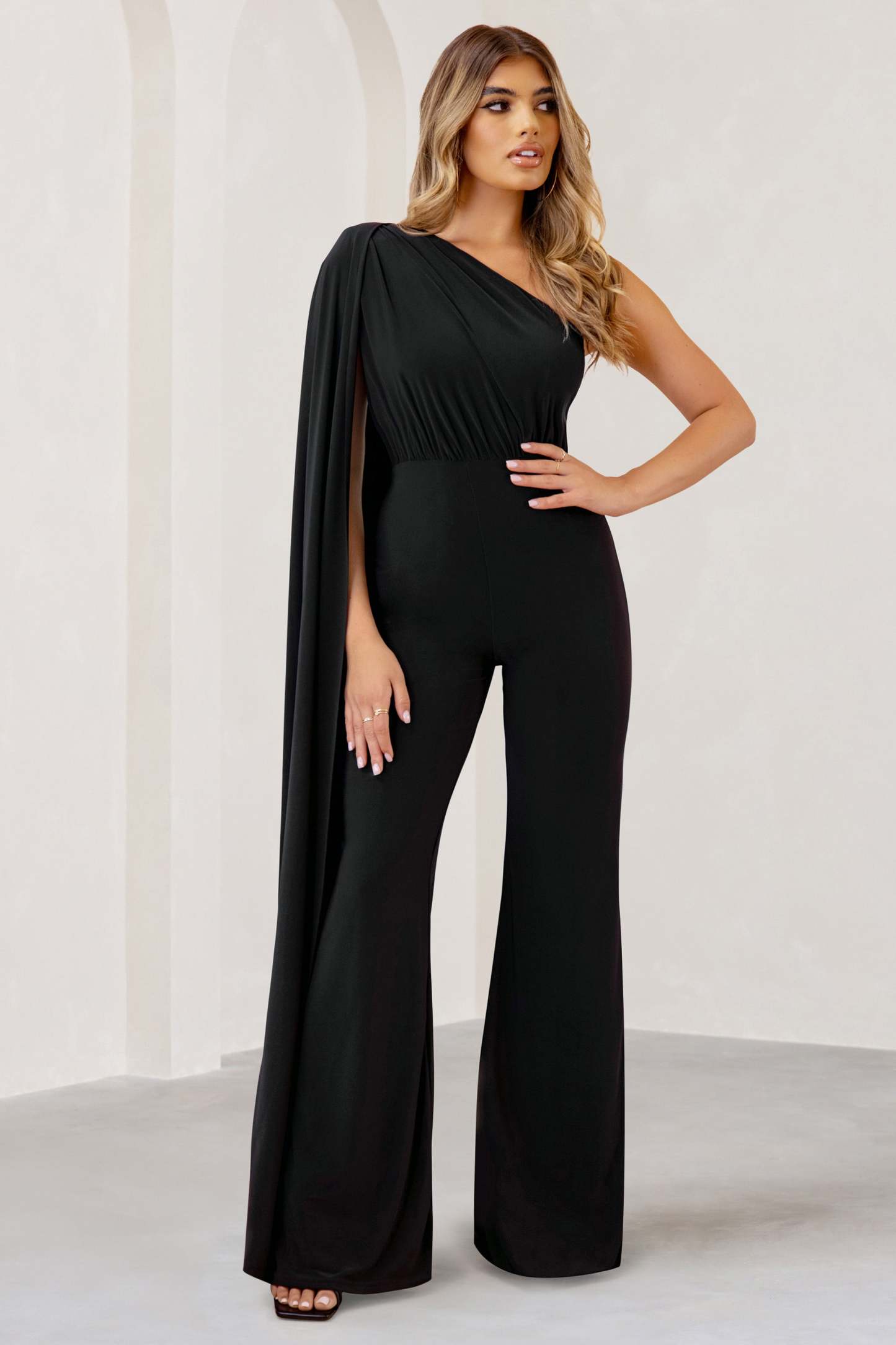 Aurora Black One Shoulder Cape Sleeve Jumpsuit-Fashionmomo.All Rights Reserved