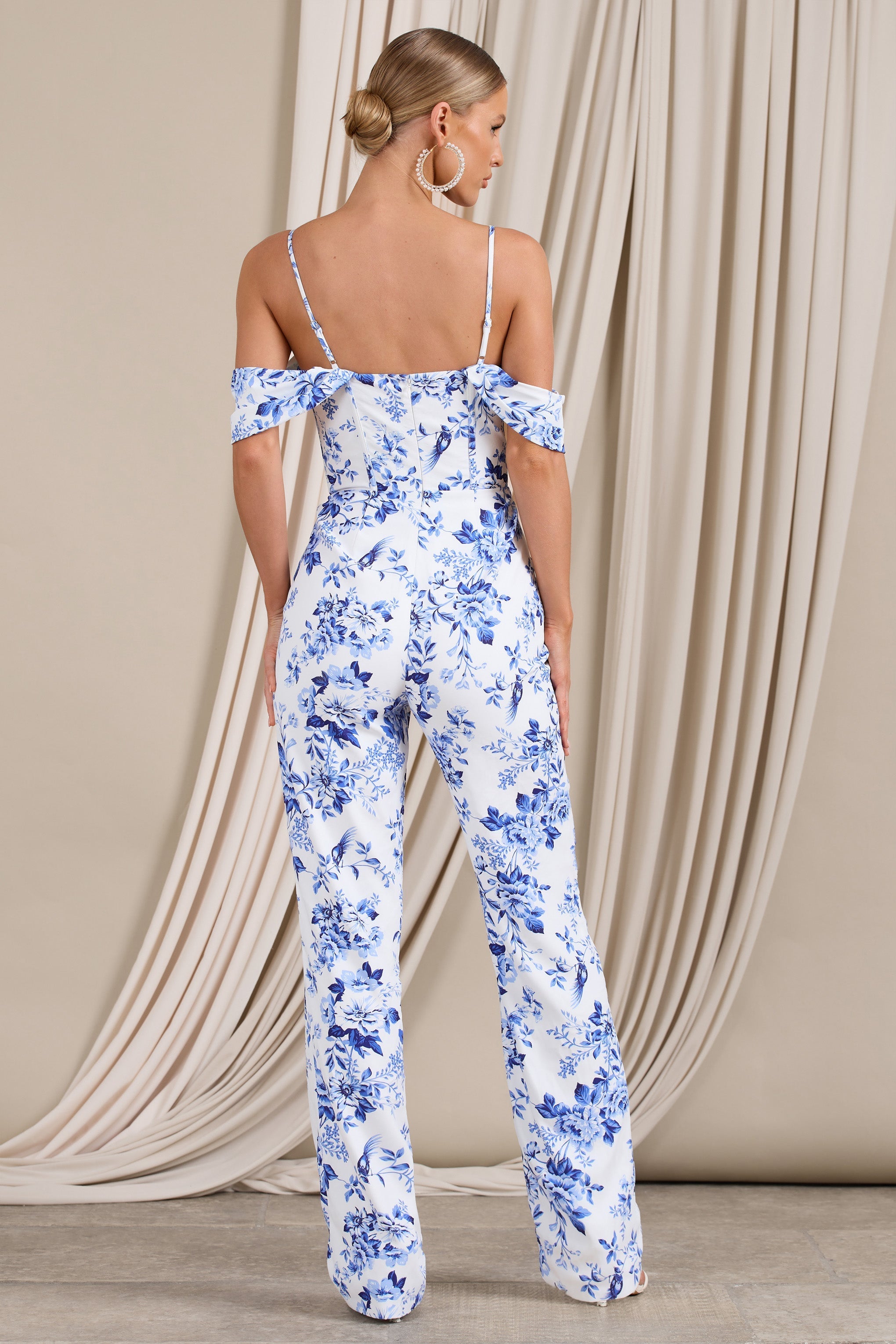 From The Vine Blue Floral Strappy Drape-Sleeved Corset Jumpsuit-Fashionmomo.All Rights Reserved