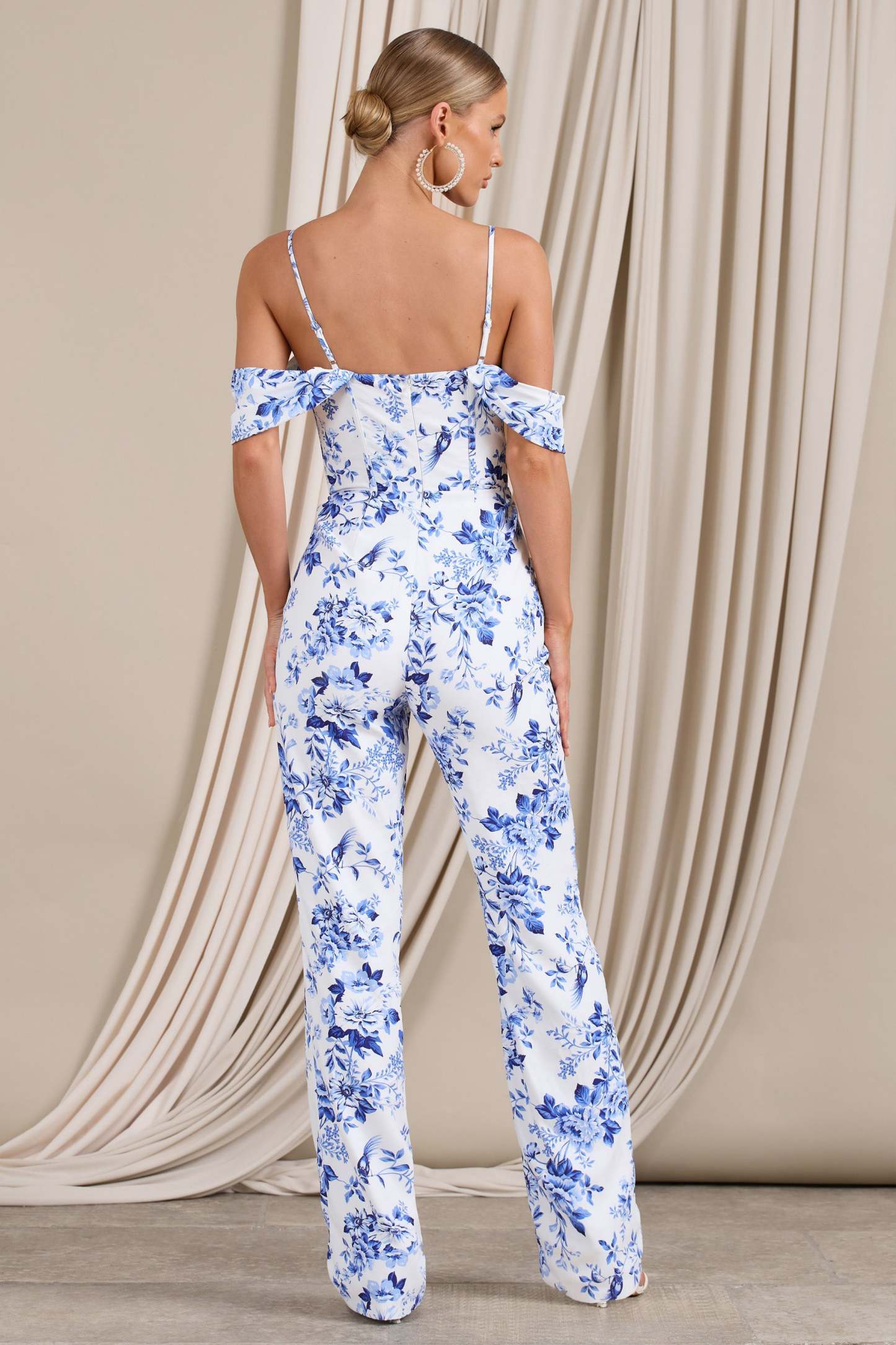From The Vine Blue Floral Strappy Drape-Sleeved Corset Jumpsuit-Fashionmomo.All Rights Reserved