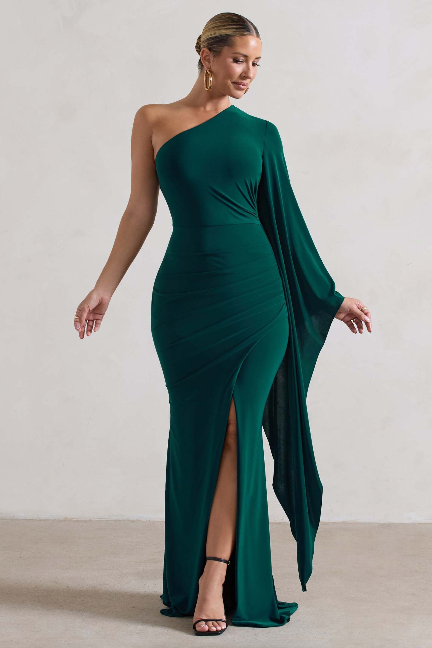 Giada Bottle Green Ruched Asymmetric Maxi Dress With Cape Sleeve-Fashionmomo.All Rights Reserved