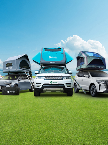 Six vehicles equipped with PlayDo inflatable rooftop tents, displayed outdoors by the lake