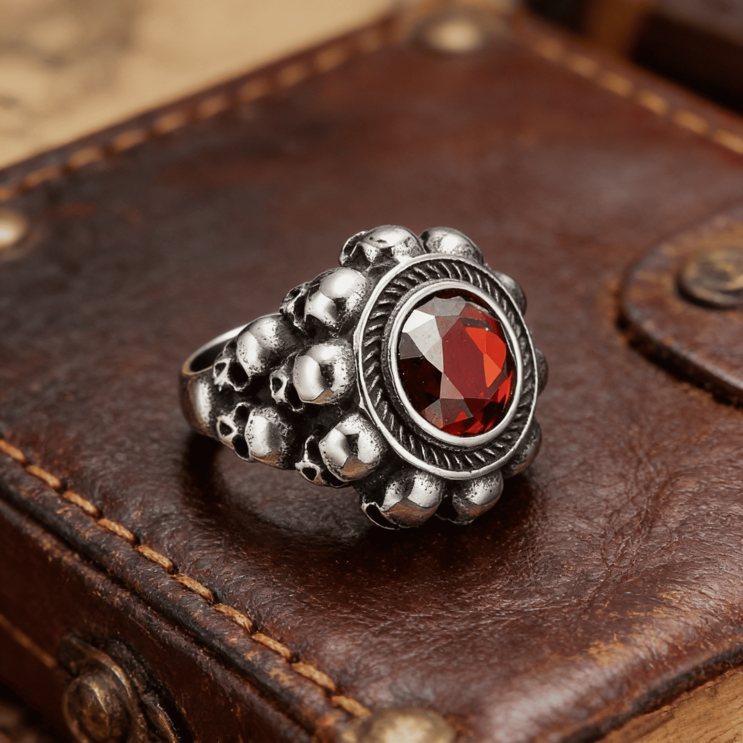 Red round gemstone skull ring