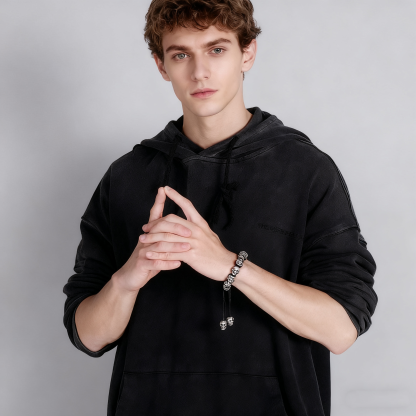 Hand-woven sterling silver skull bracelet