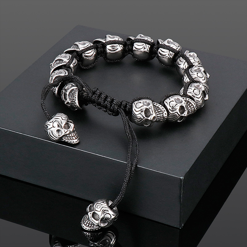 Hand-woven sterling silver skull bracelet