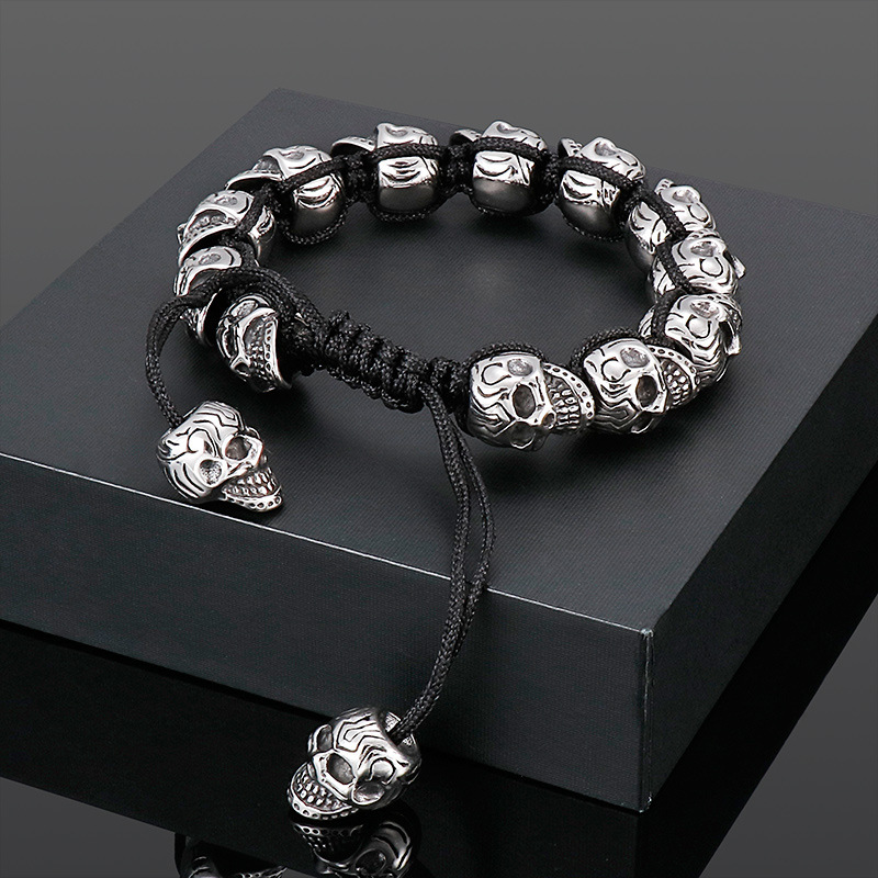 Hand-woven sterling silver skull bracelet