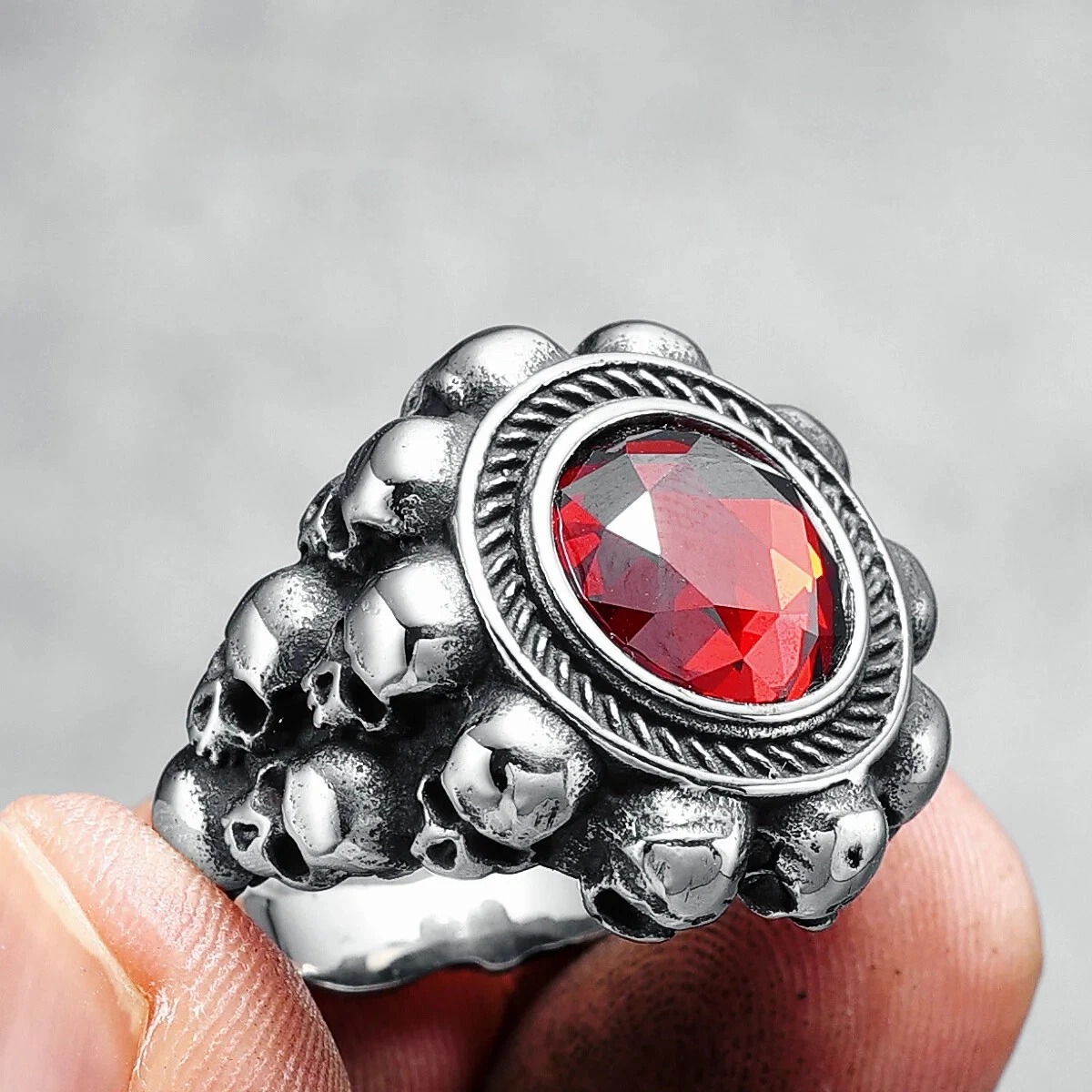 Red round gemstone skull ring
