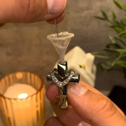 Cross necklace (can hold ashes/perfume)