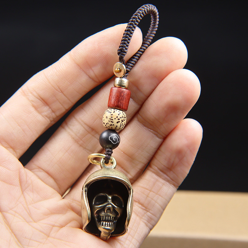 Brass skull helmet bell charm
