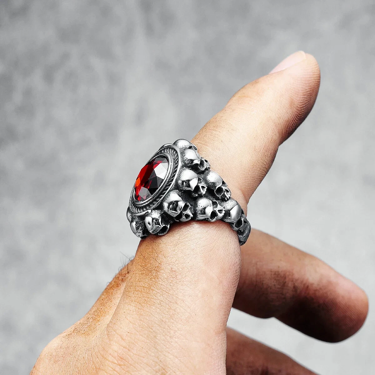 Red round gemstone skull ring