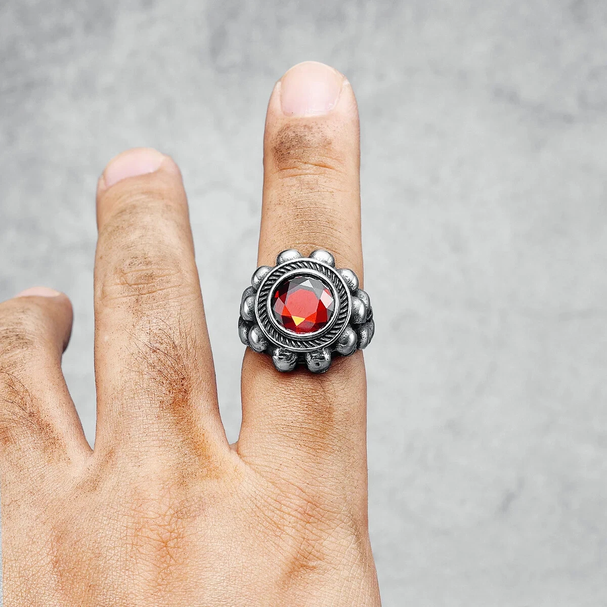 Red round gemstone skull ring