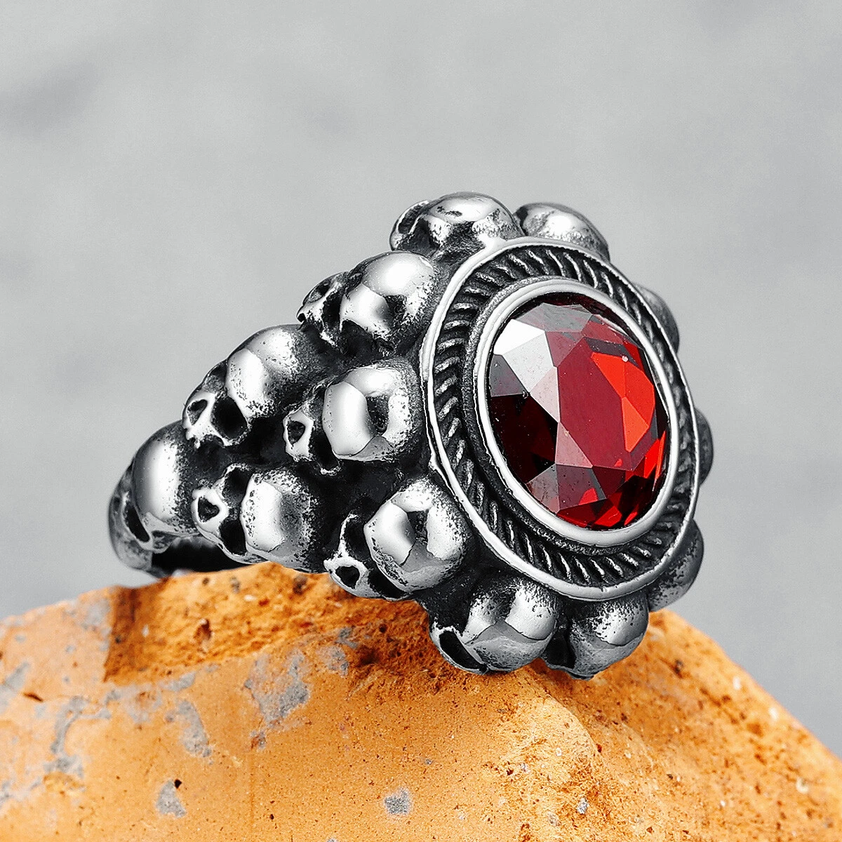 Red round gemstone skull ring