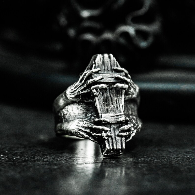 Old coffin skull finger ring
