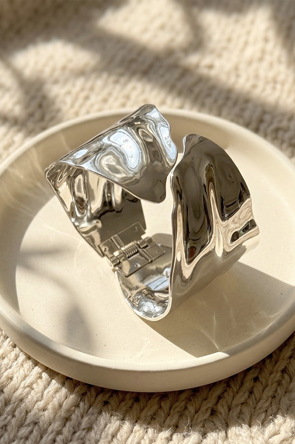 A Stylish and Distinctive Open-style Bracelet Featuring An Irregular, Crisscross Design.