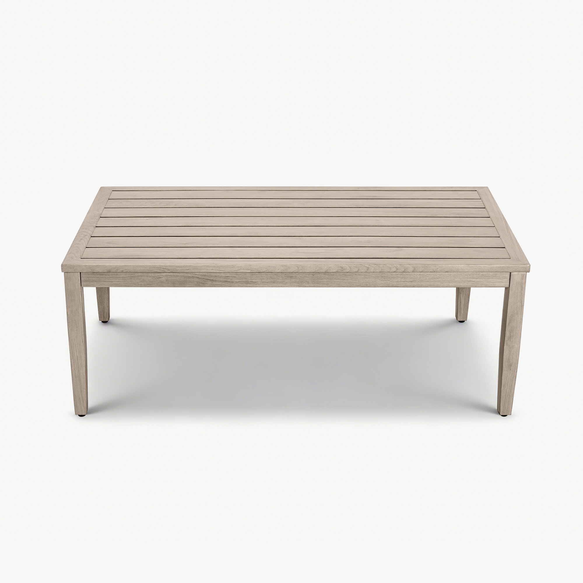Rectangular outdoor coffee table with faux wood grain finish and slatted top on a bright out-Seehill