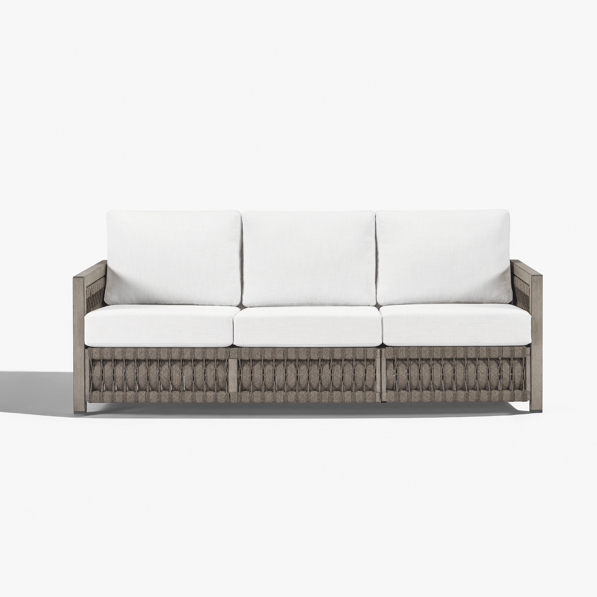 Modern outdoor sofa with white cushions and woven frame - Seehill