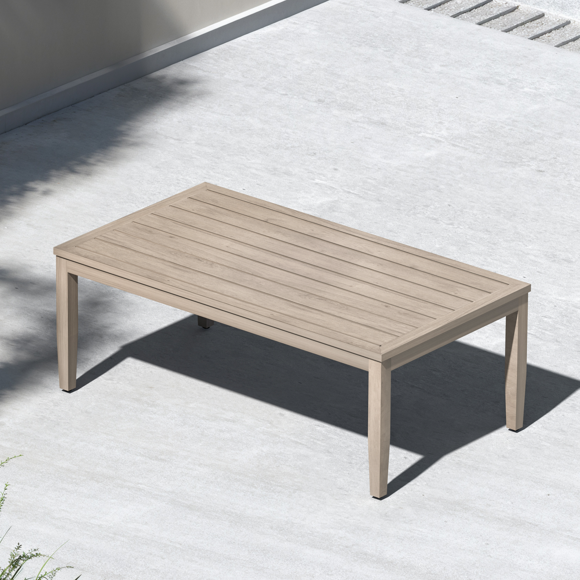 Outdoor patio coffee table with faux wood grain finish on a concrete surface-Seehill