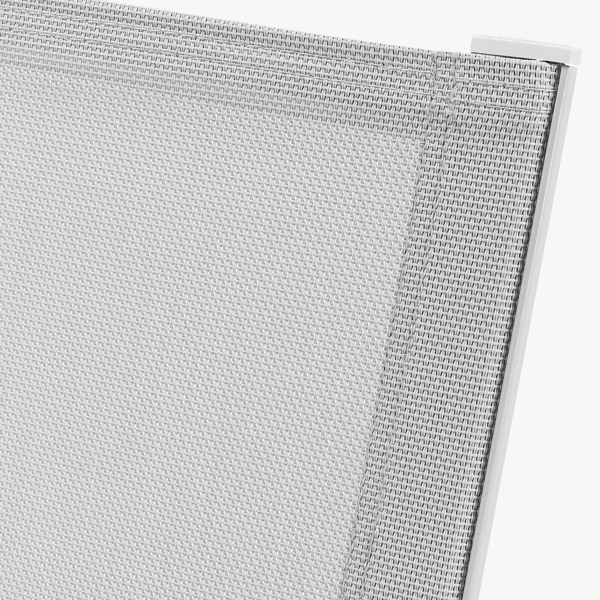 Close-up of white mesh fabric and frame detail on stackable patio dining chairs -Seehill