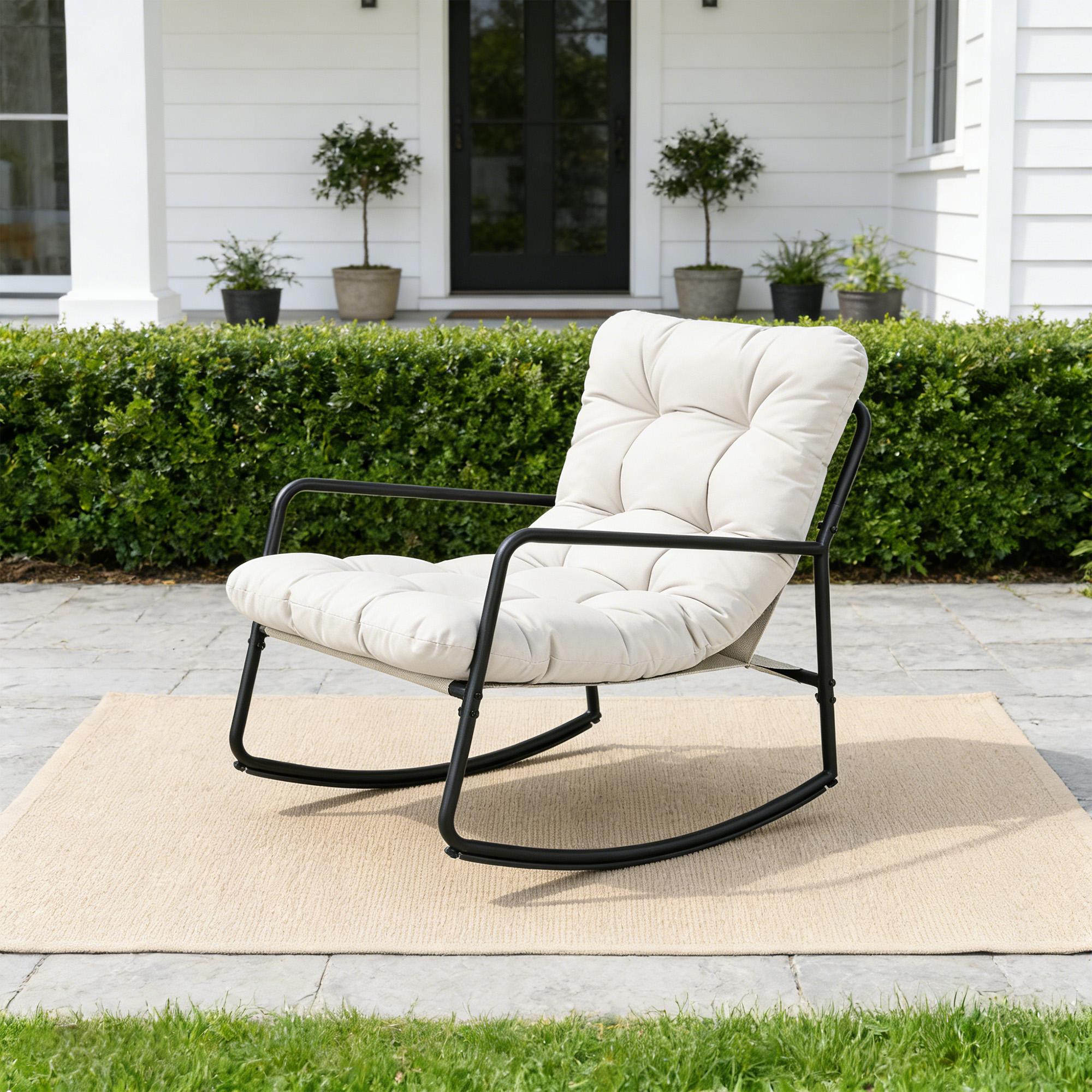 Modern metal patio rocking chair with thick cushioned seat on outdoor stone patio-Seehill