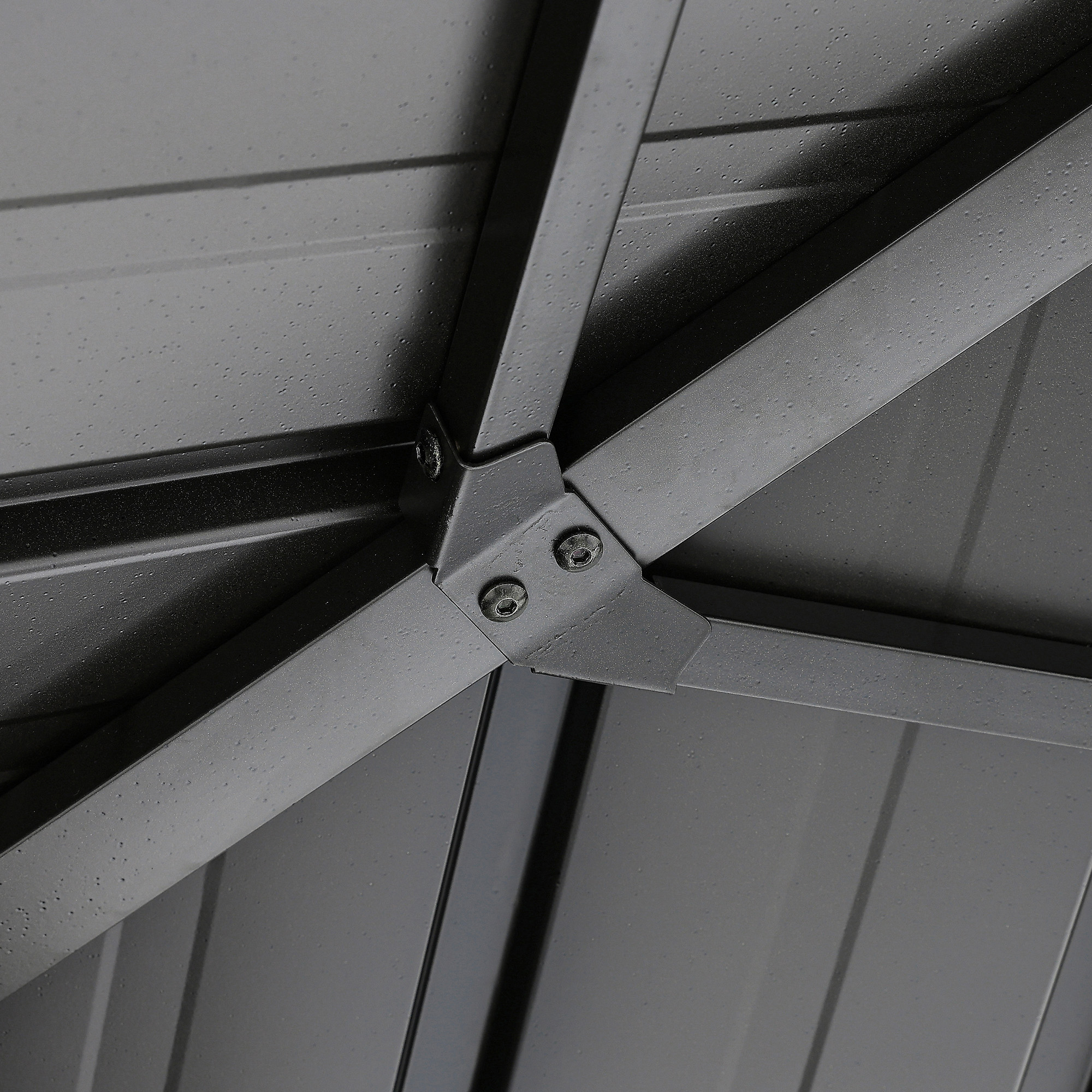 Close-up of metal frame and roof panels with water droplets on outdoor gazebo roof -Seehill