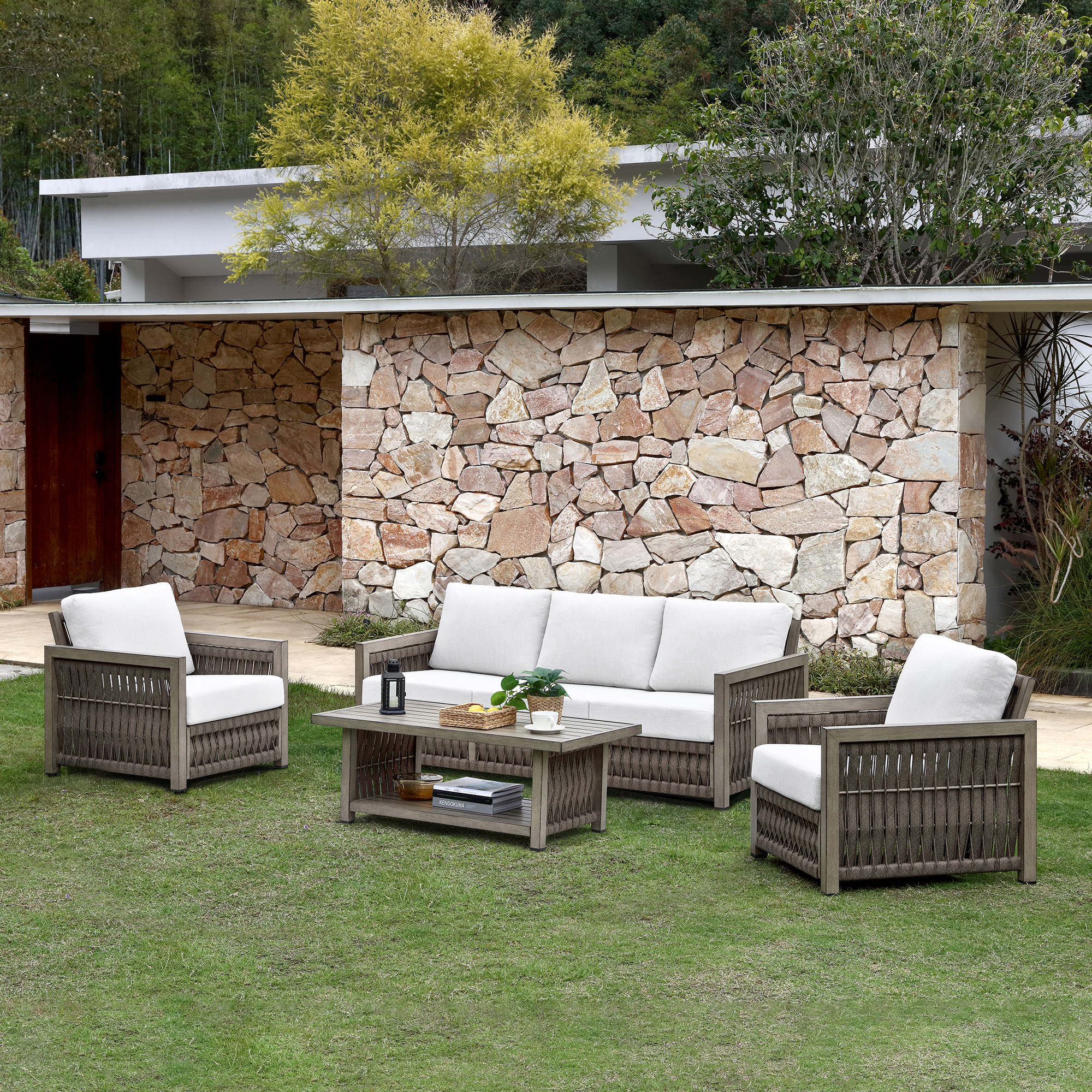Experience the outdoor wicker patio set with white cushions, a coffee table, and a modern design in our opulent collection. - Seehill