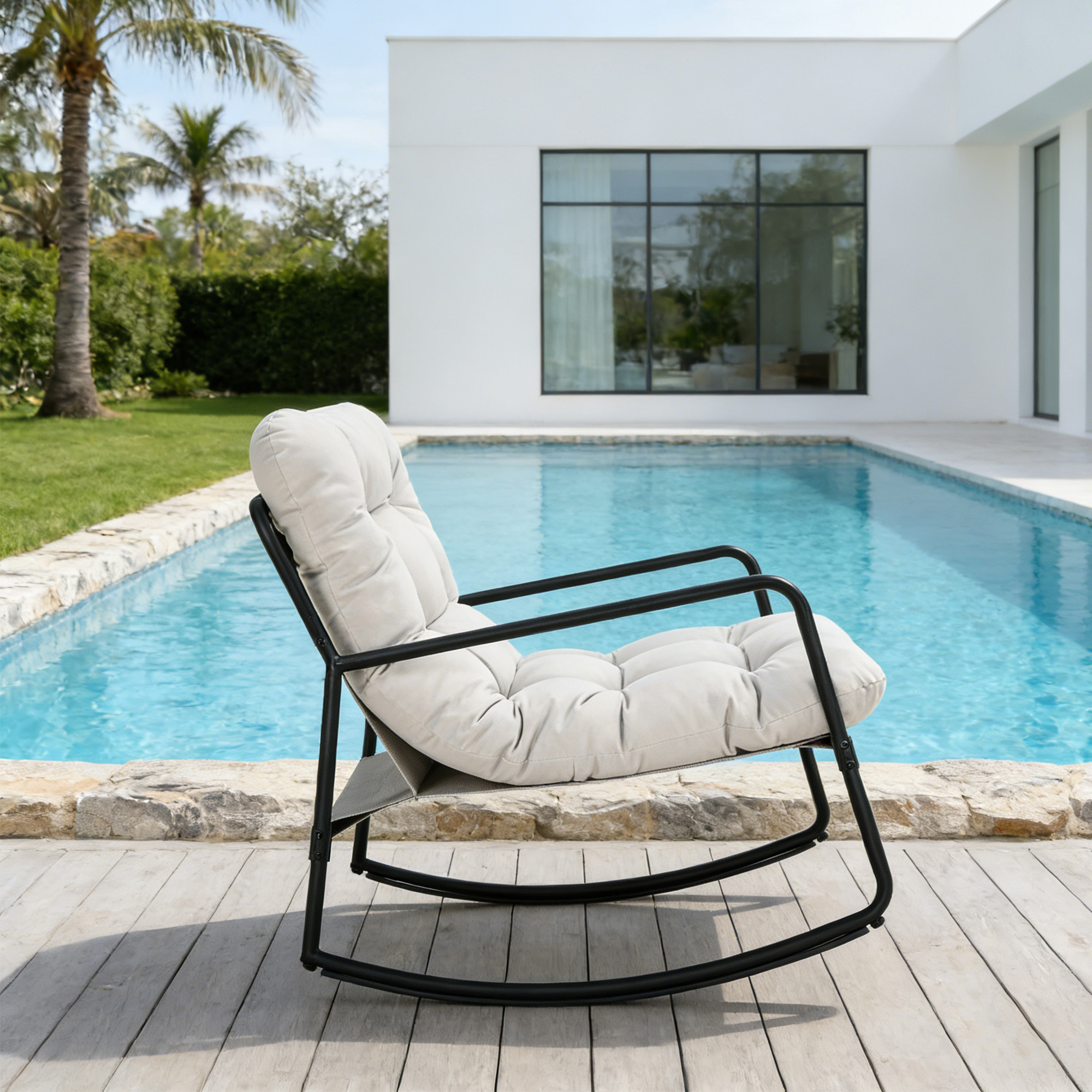 Modern metal patio rocking chair with thick cushioned seat by the poolside outdoors -Seehill