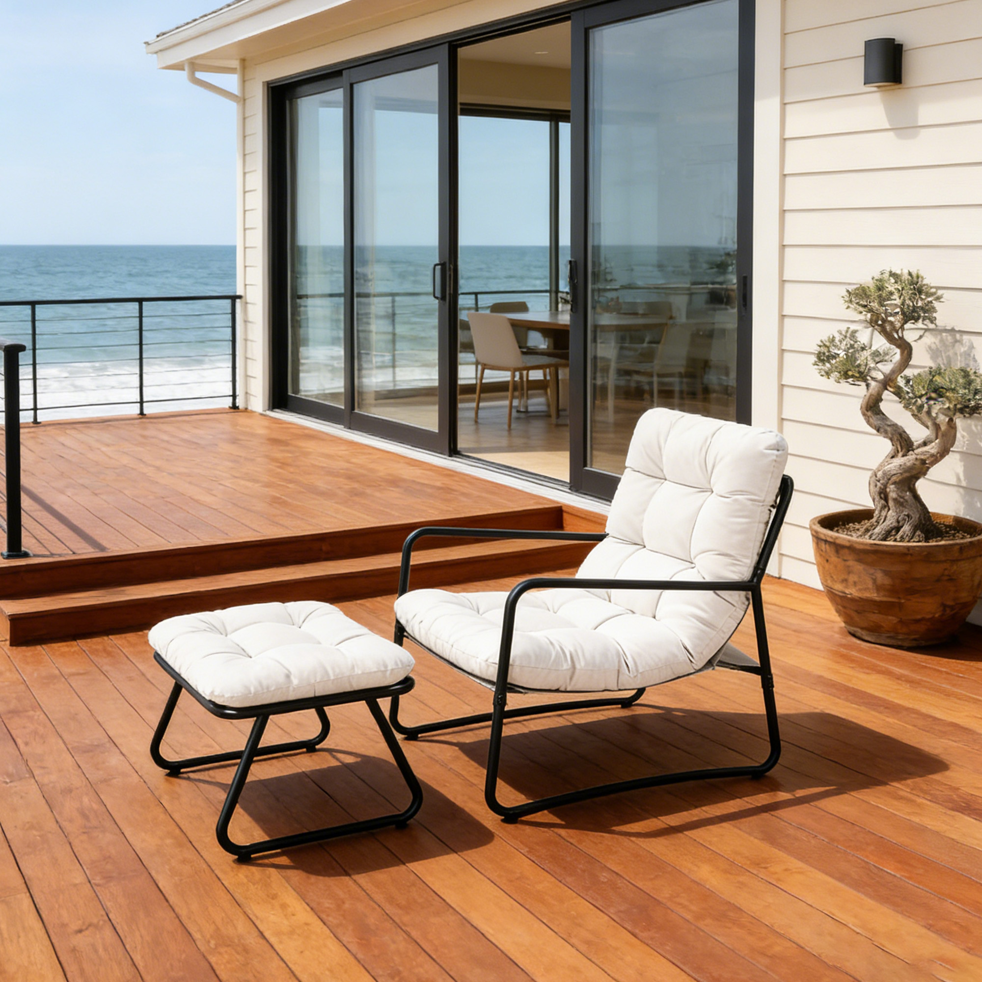Modern metal patio rocking chair with cushioned seat and matching ottoman on wooden deck-Seehill