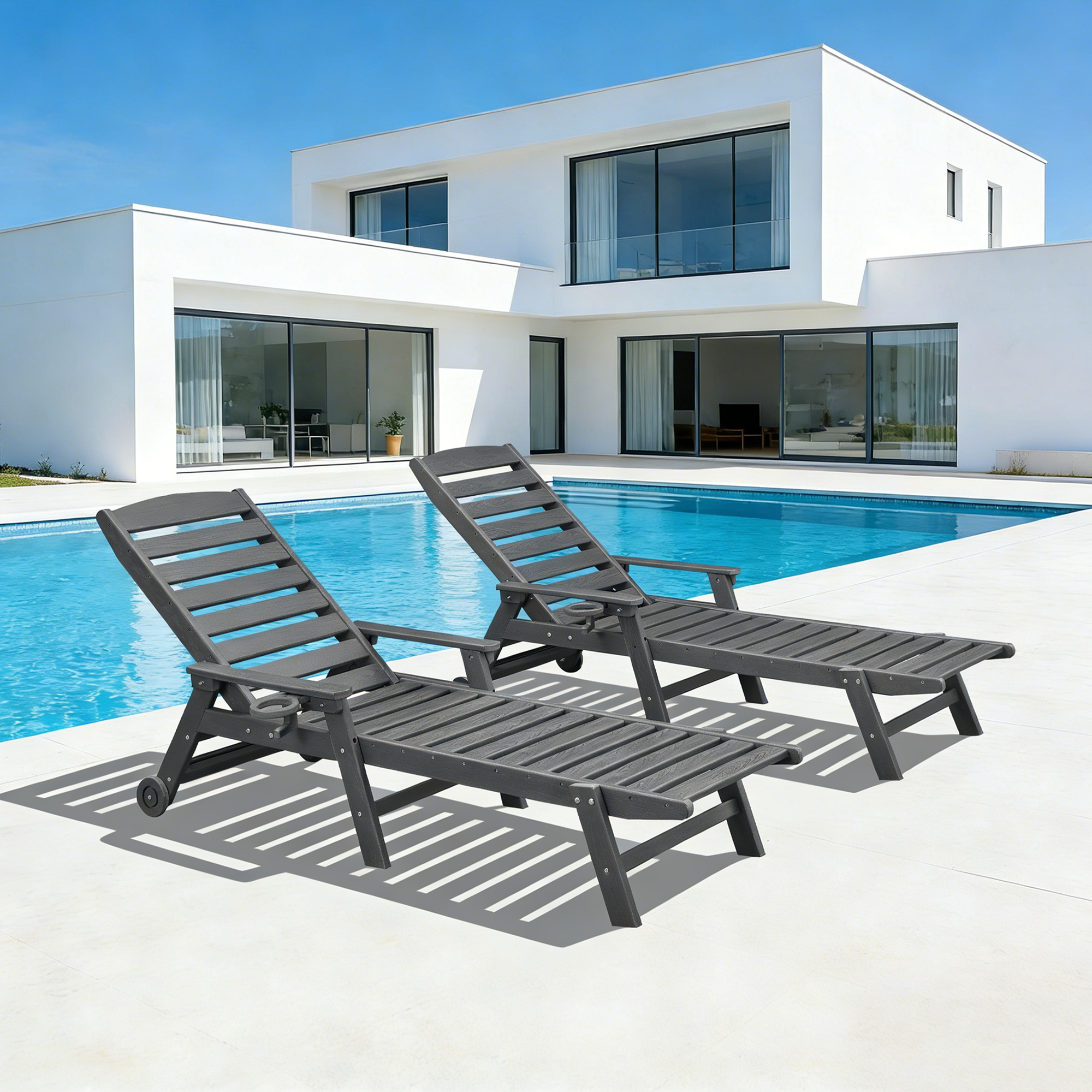Two adjustable outdoor lounge chairs with cup holders by a modern poolside patio-Seehill