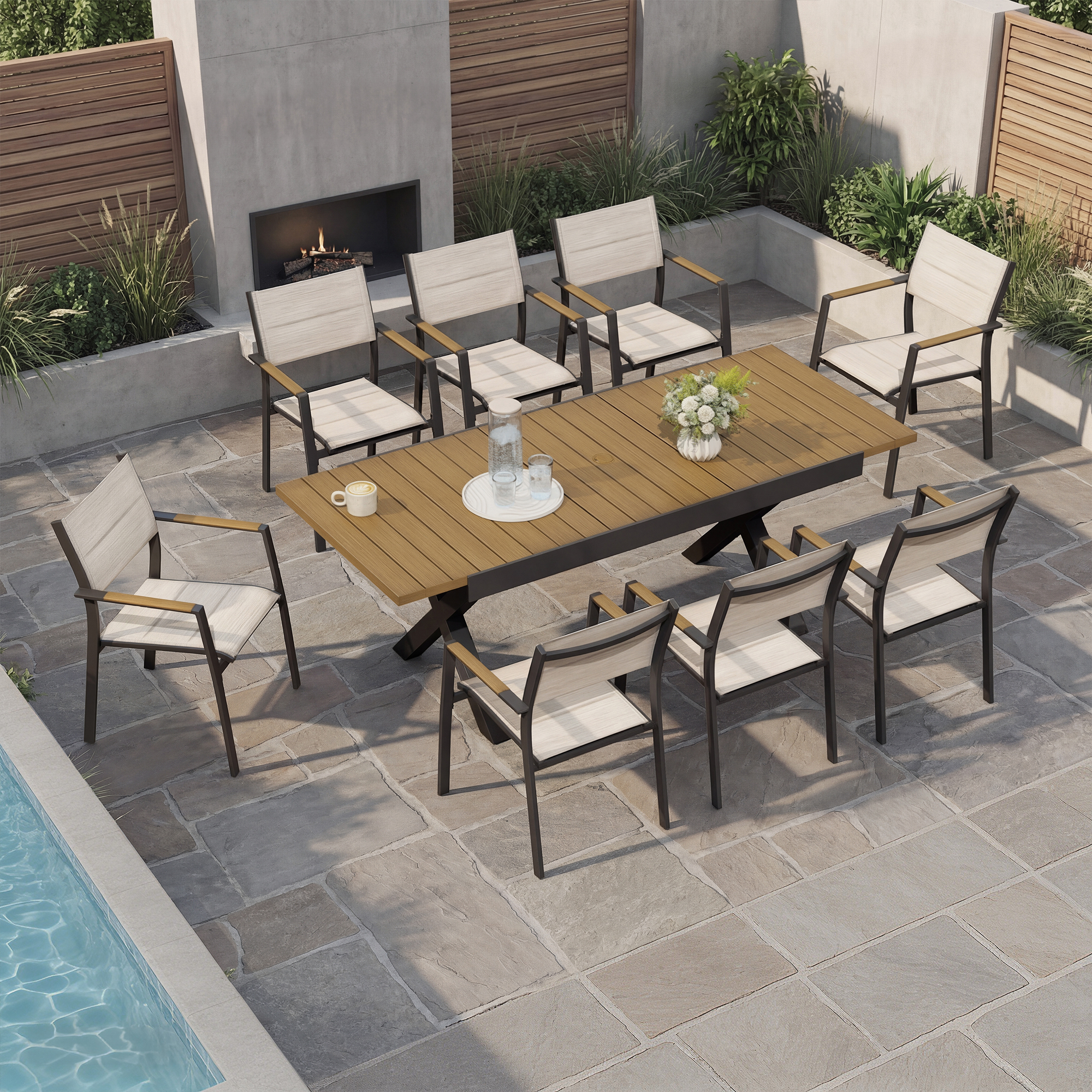 Expandable outdoor dining set with stackable chairs arranged by a poolside patio-Seehill