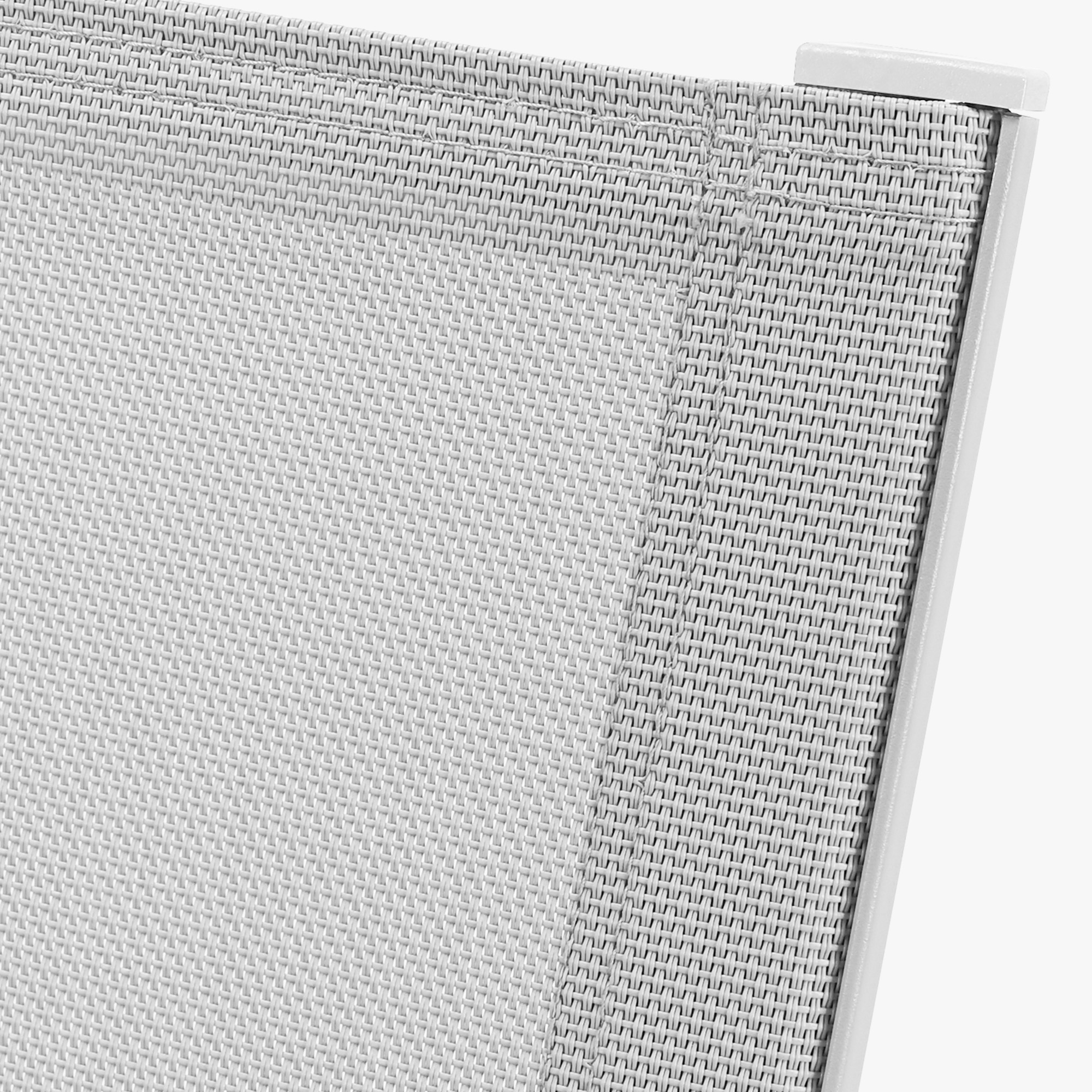 Close-up of white woven fabric and metal frame detail on outdoor dining chair -Seehill