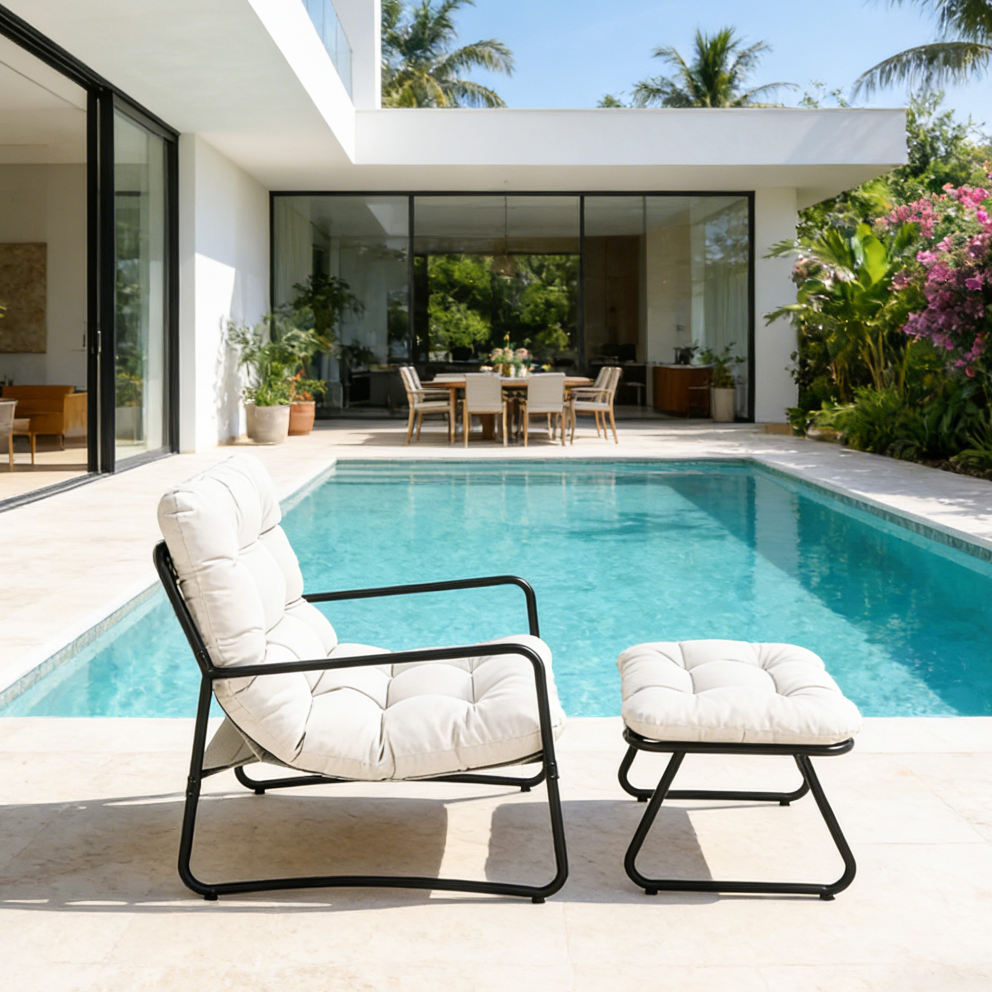 Modern metal patio rocking chair with cushioned seat and matching ottoman by poolside -Seehill