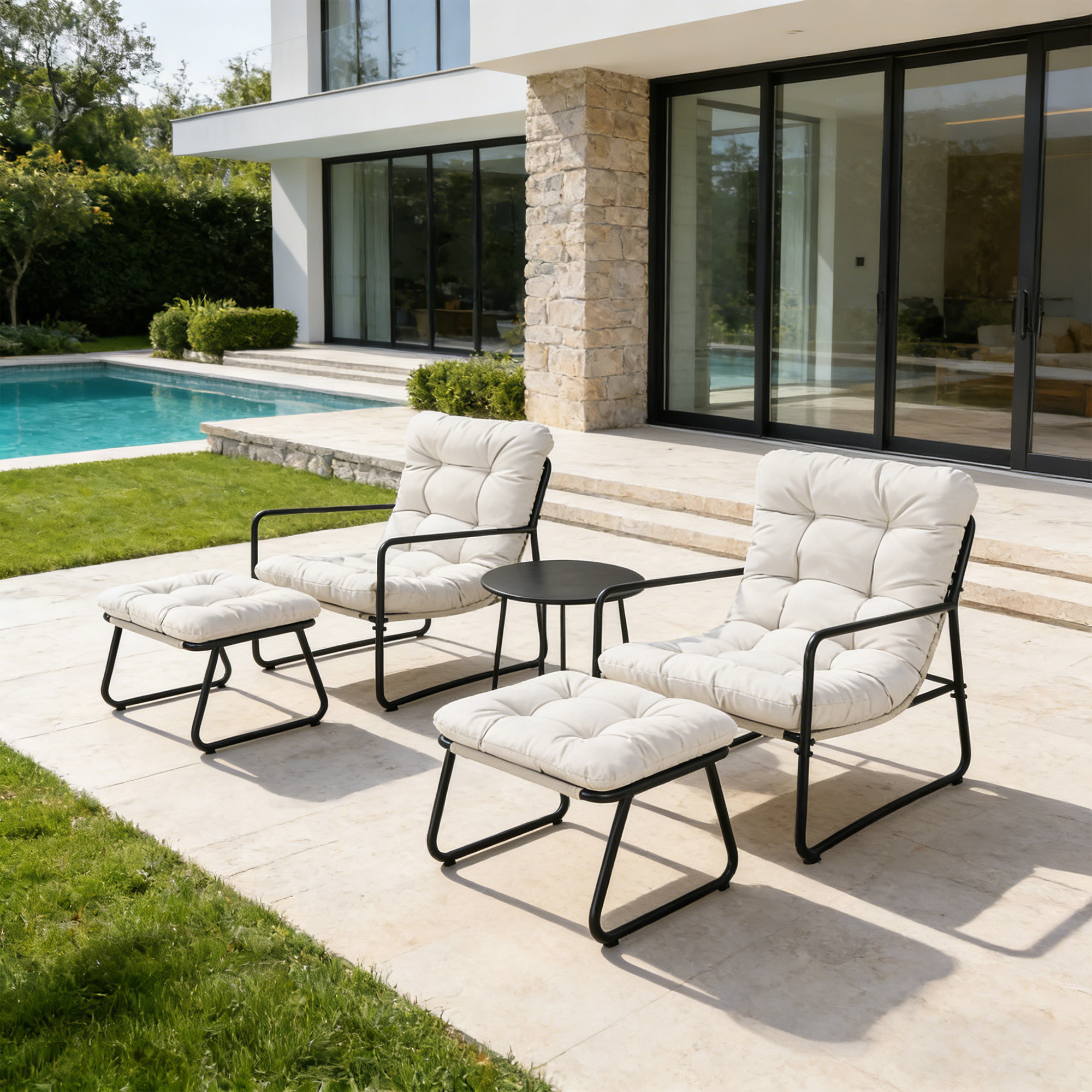 Two modern metal patio rocking chairs with cushioned seats and ottomans by a poolside -Seehill