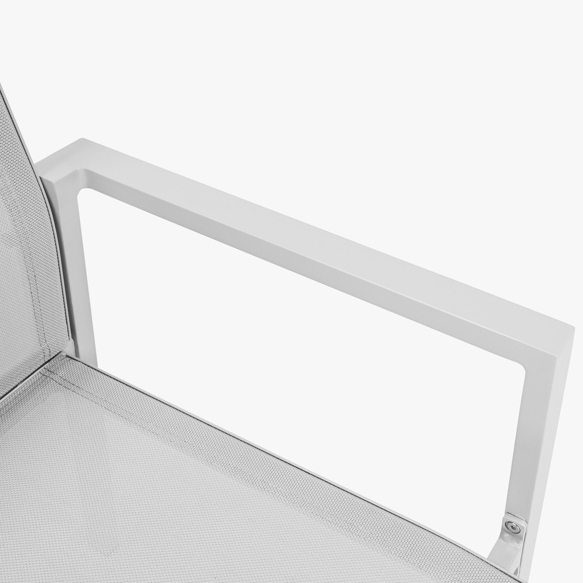 Close-up of white metal armrest and mesh seat of stackable patio dining chair -Seehill