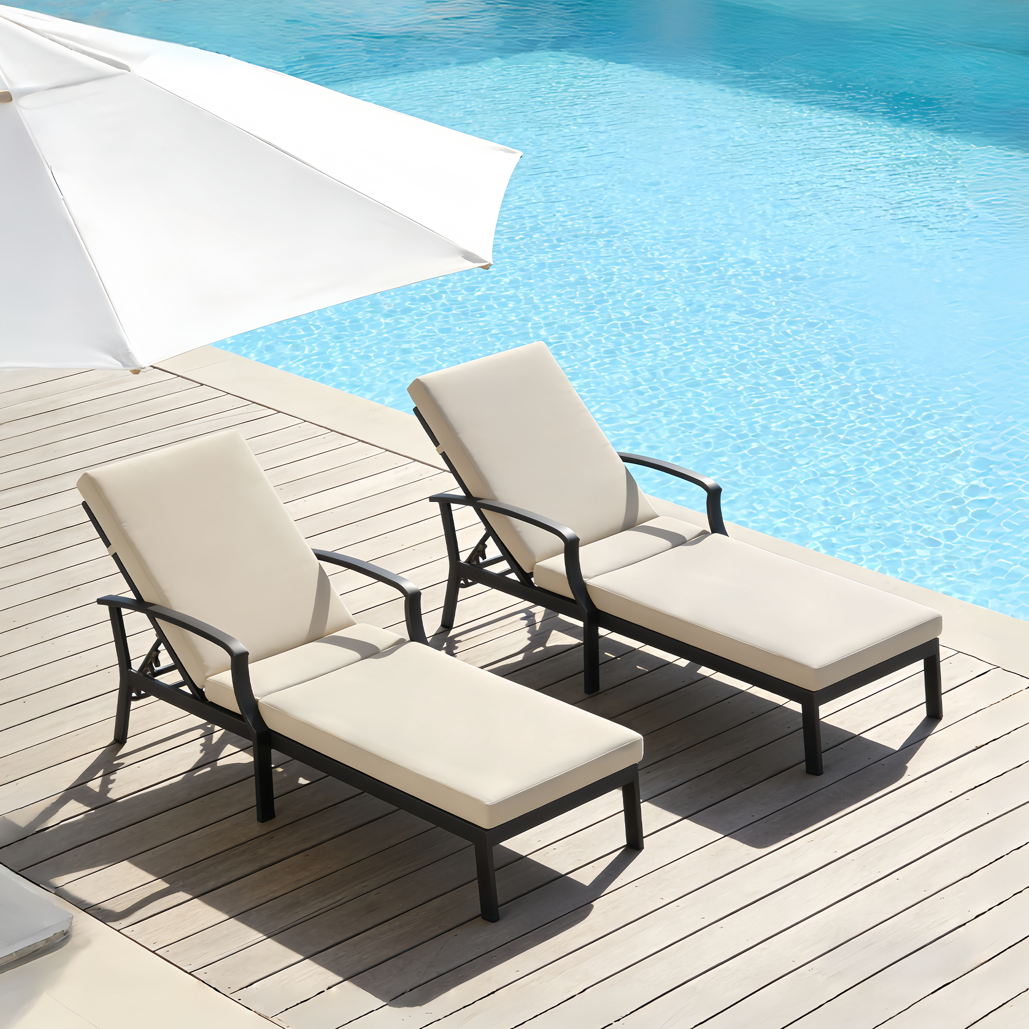 Two beige cushioned outdoor lounge chairs with adjustable backs by a poolside deck -Seehill