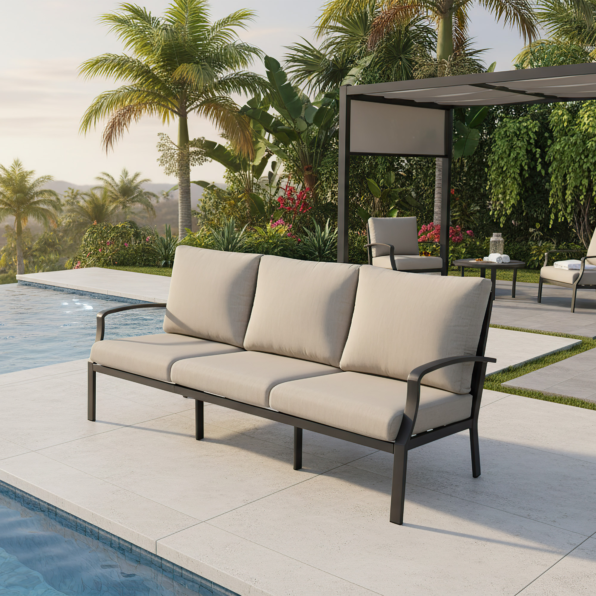 Spacious outdoor sofa with neutral cushions by the pool in a tropical garden setting -Seehill