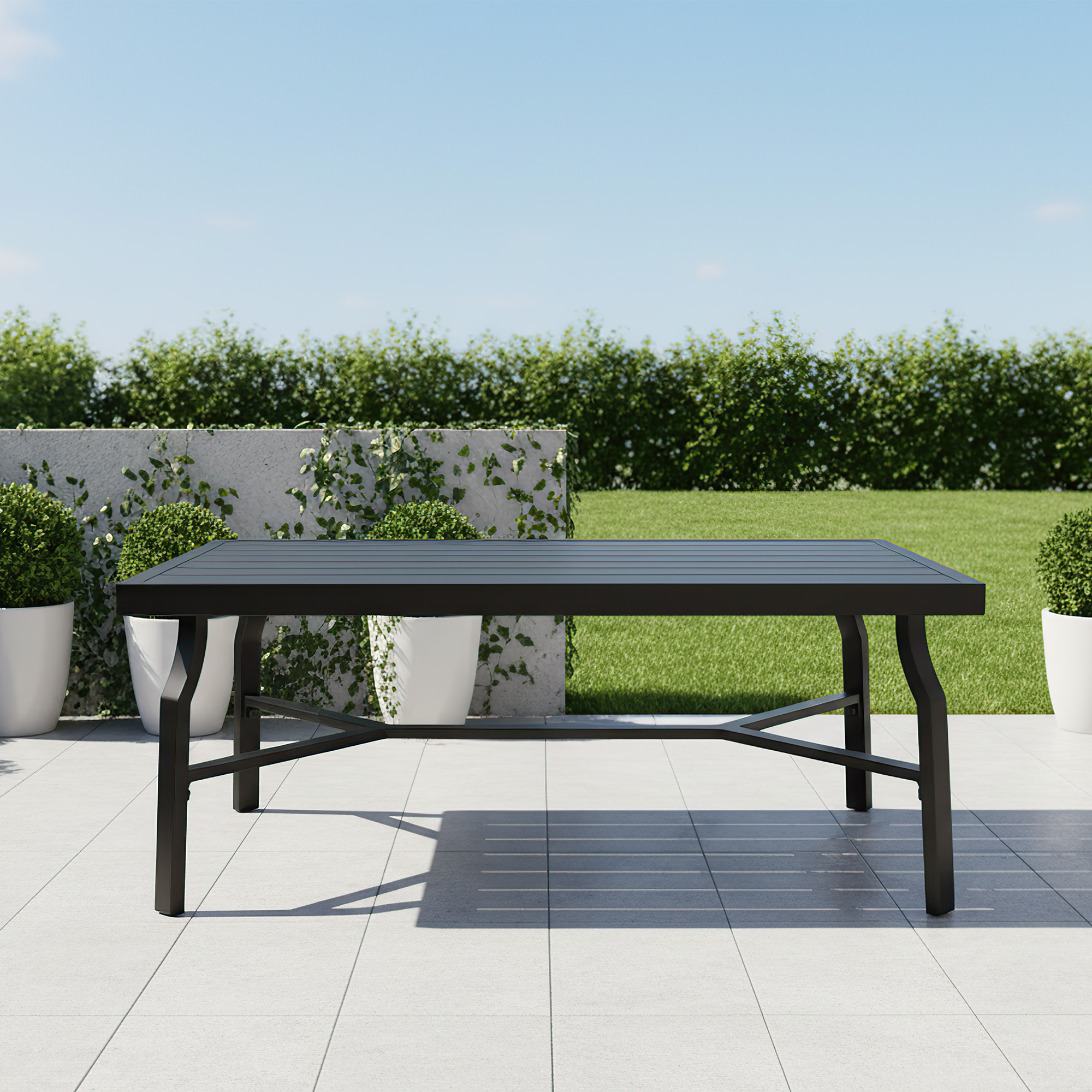 Outdoor patio coffee table with slatted top on tiled floor surrounded by greenery-Seehill